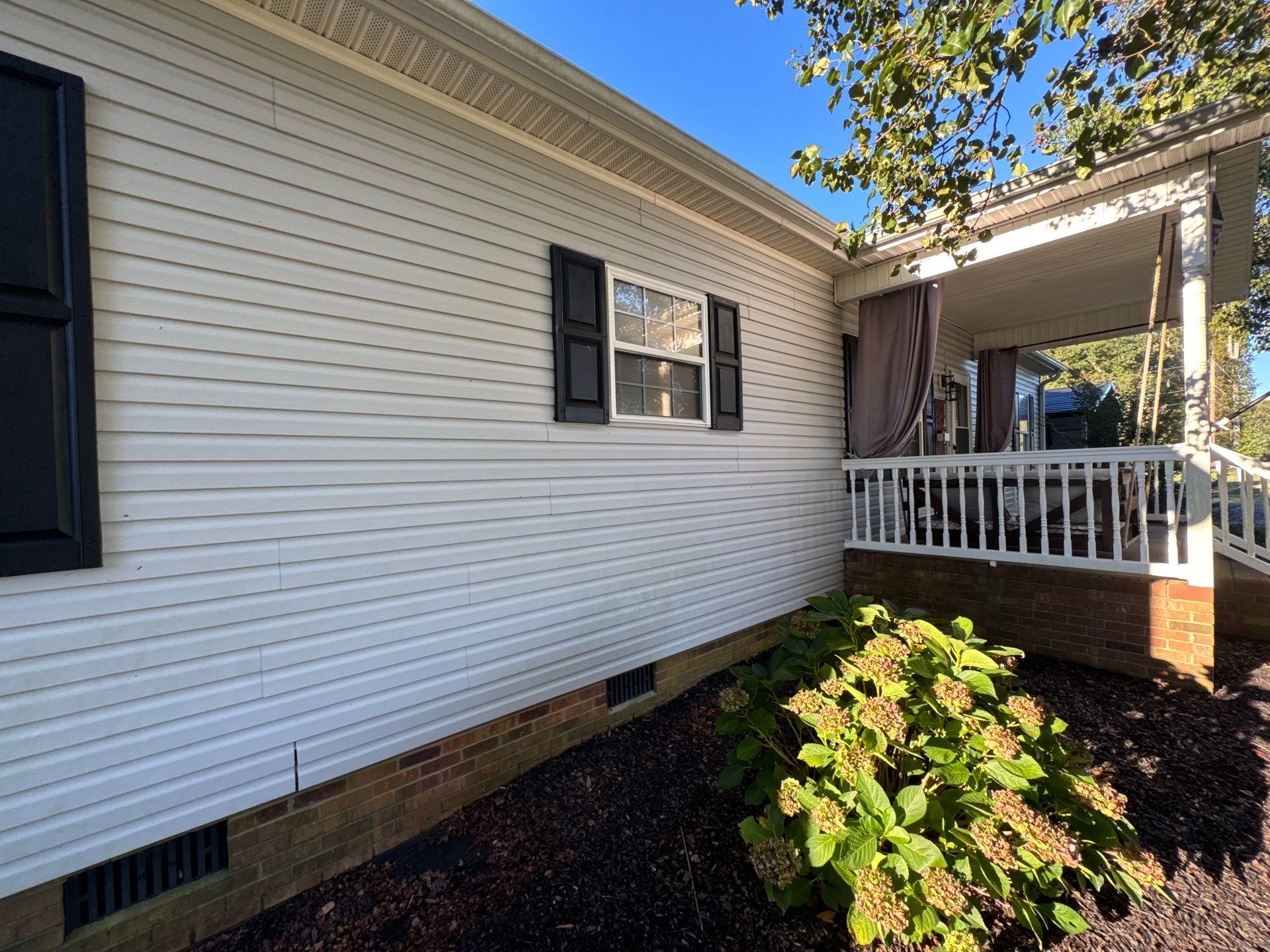 the service being done is cleaning the exterior siding of the house for improved appearance and maintenance purposes