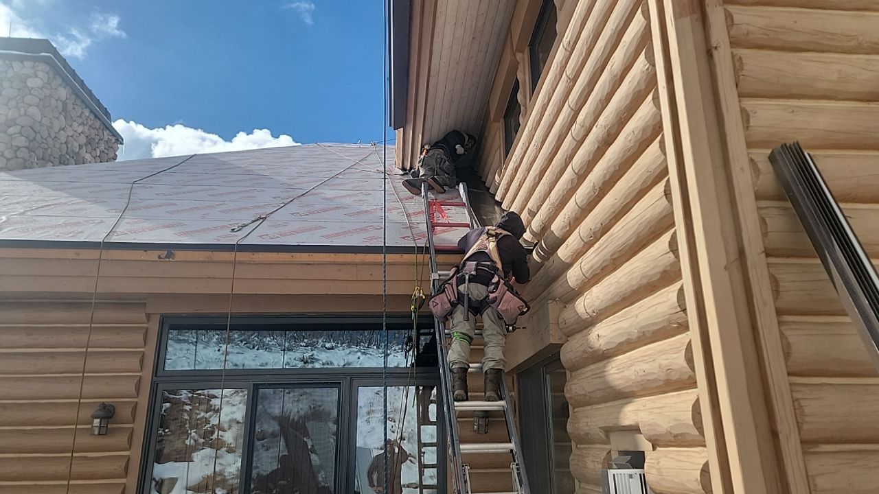 Standing Seam Metal Roof Replacement After Snow Damage by ASAP Roofing & Restoration