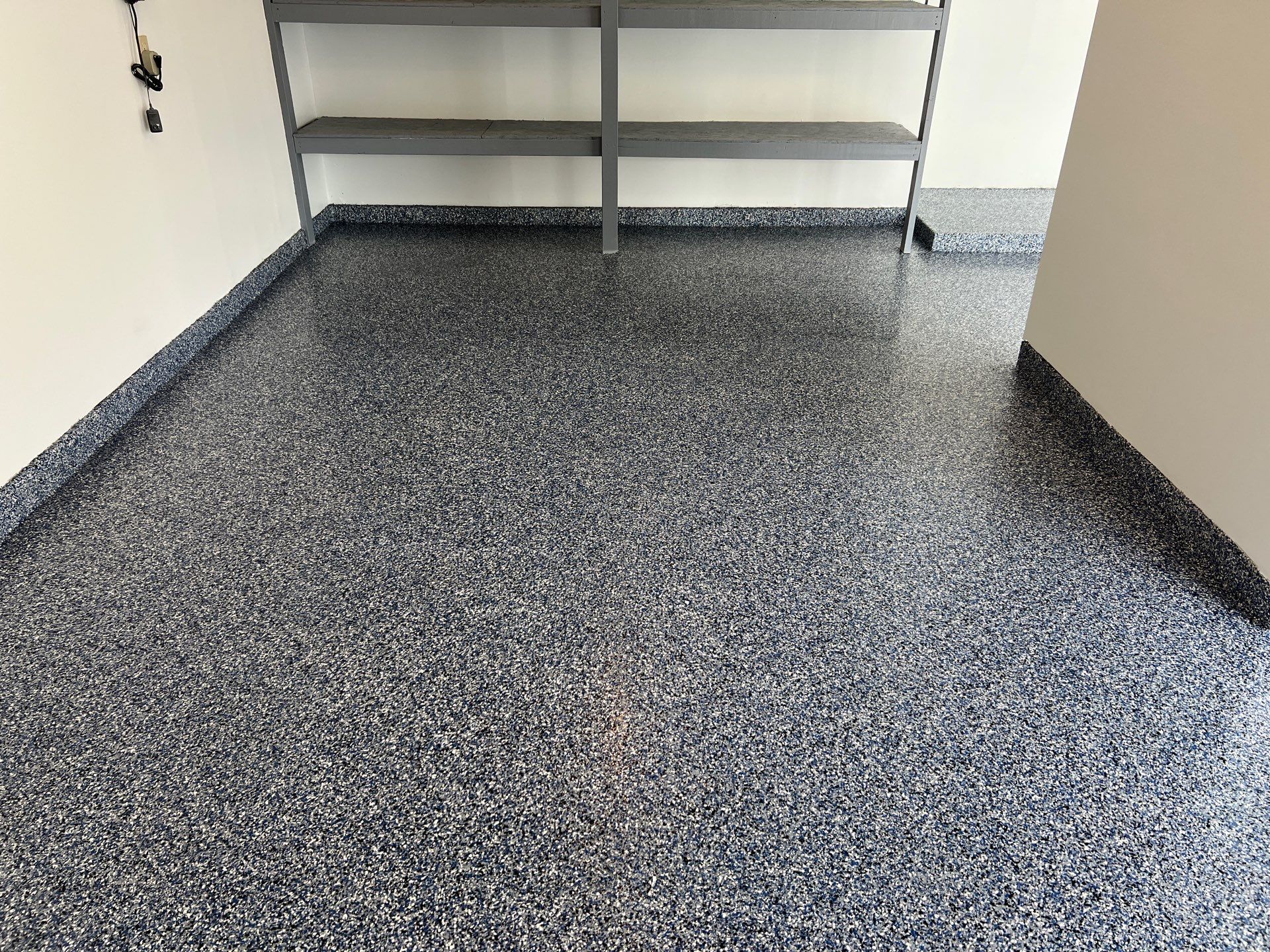 Custom Epoxy Flake Floor and Garage Wall Renovation in Ada by Gordon Painting