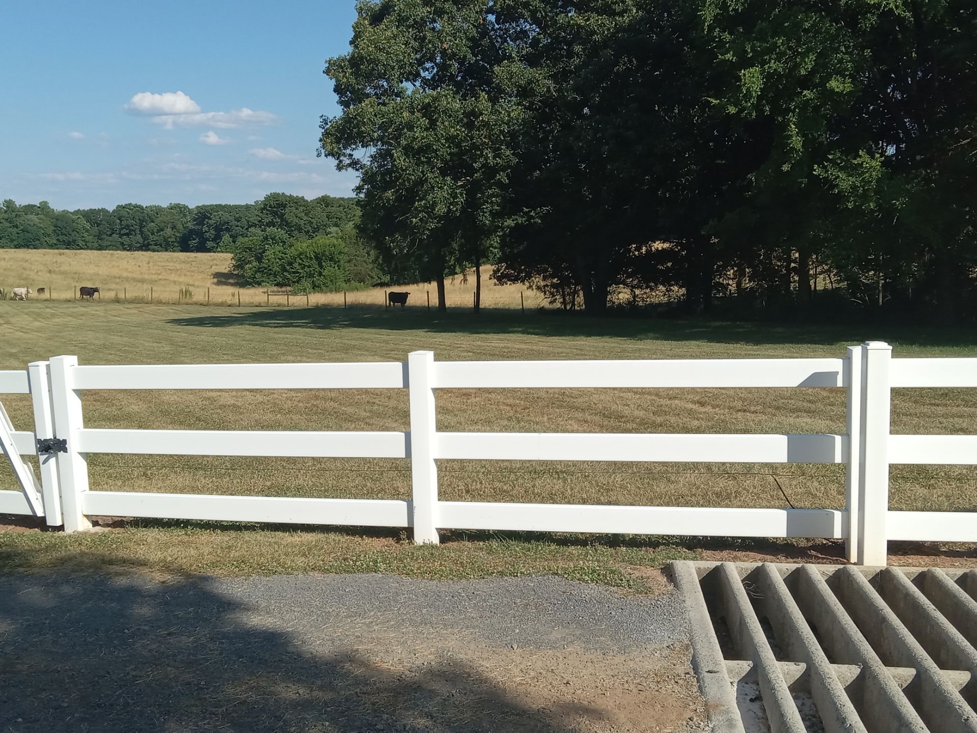 pressure washing white fence to remove dirt buildup and maintain appearance