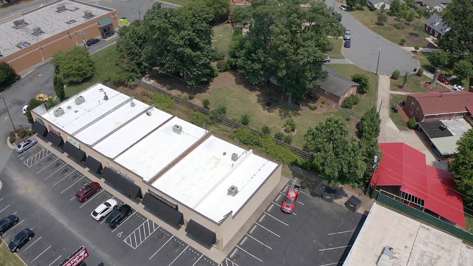 Commercial Roof Coating using Fiberseal basecoat and Silicon Topcoat by Just In Time Roofing and Restoration