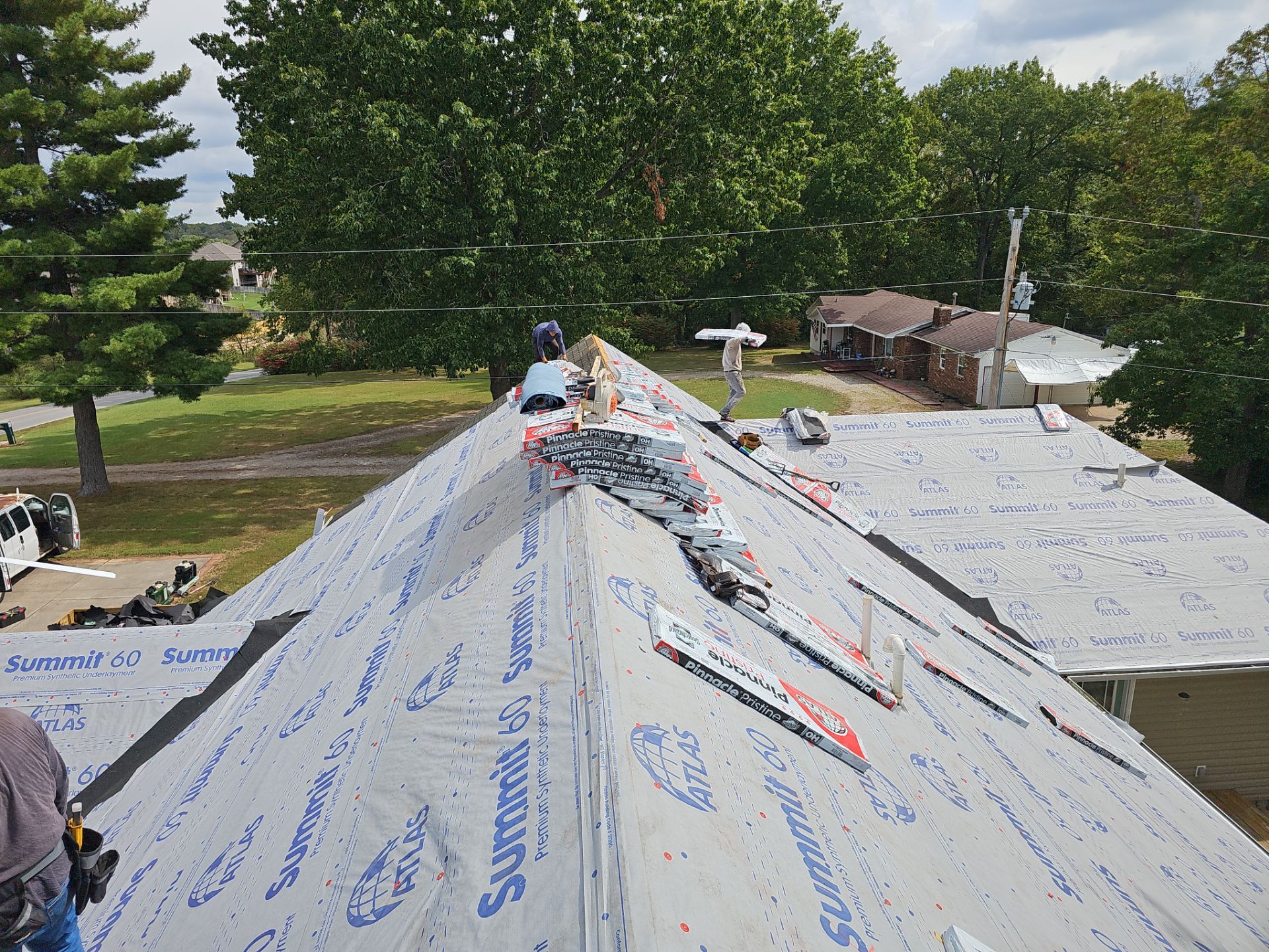 Residential Roofing Install - Green Atlas Pinnacle Pristine Shingles - White Gutters & Downspouts  by Titan Commercial & Residential Roofing 