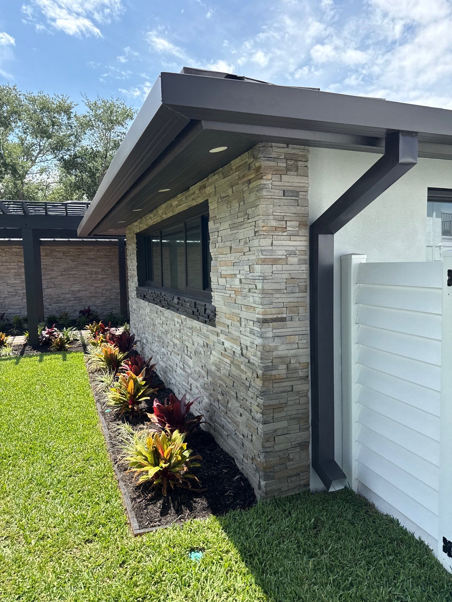 7-Inch Smooth Box Seamless Gutters using black seamless gutters in Siesta Key Fl by Gutter Professors