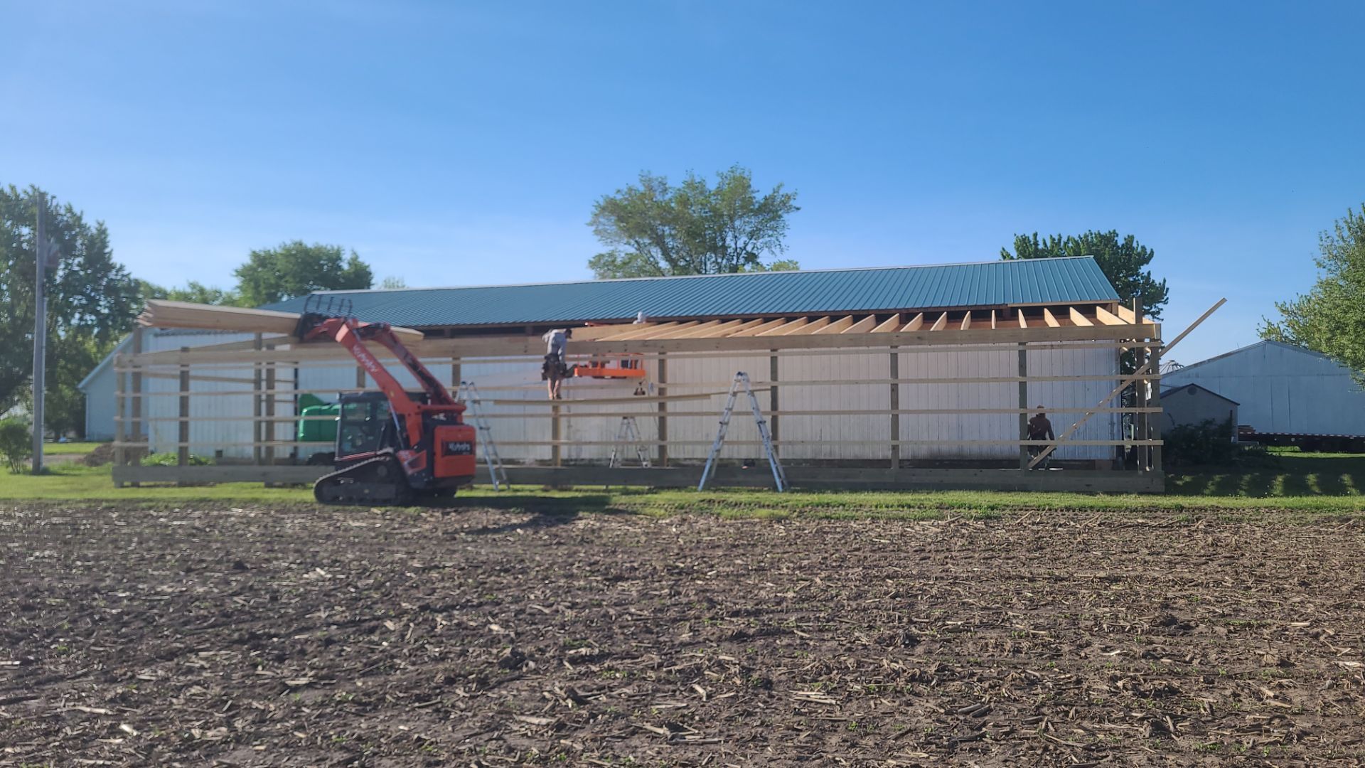 Reskin pole barn and add lean-to by Dagny Builders