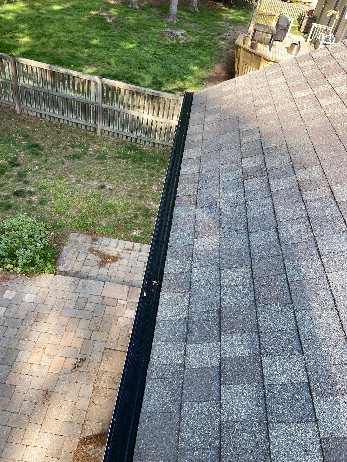 Gutter Installation using Black Gutter Guards  by Storm Ready Exteriors