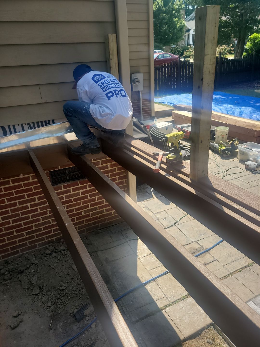 Fuquay-Varina Outdoor Upgrade – Composite Deck & Paved Landing by Elite Remodeling and Design LLC