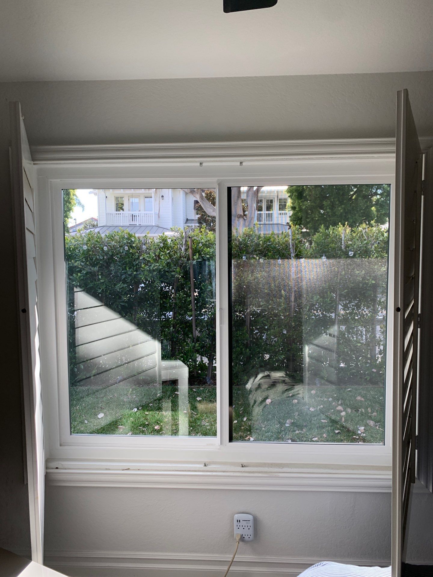 Window Installation using Milgard black vinyl windows by American Window Company