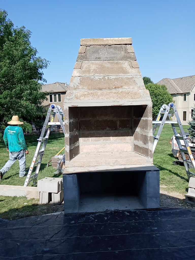 Back Yard Fireplace and Landscape by LAND ESCAPES LLC