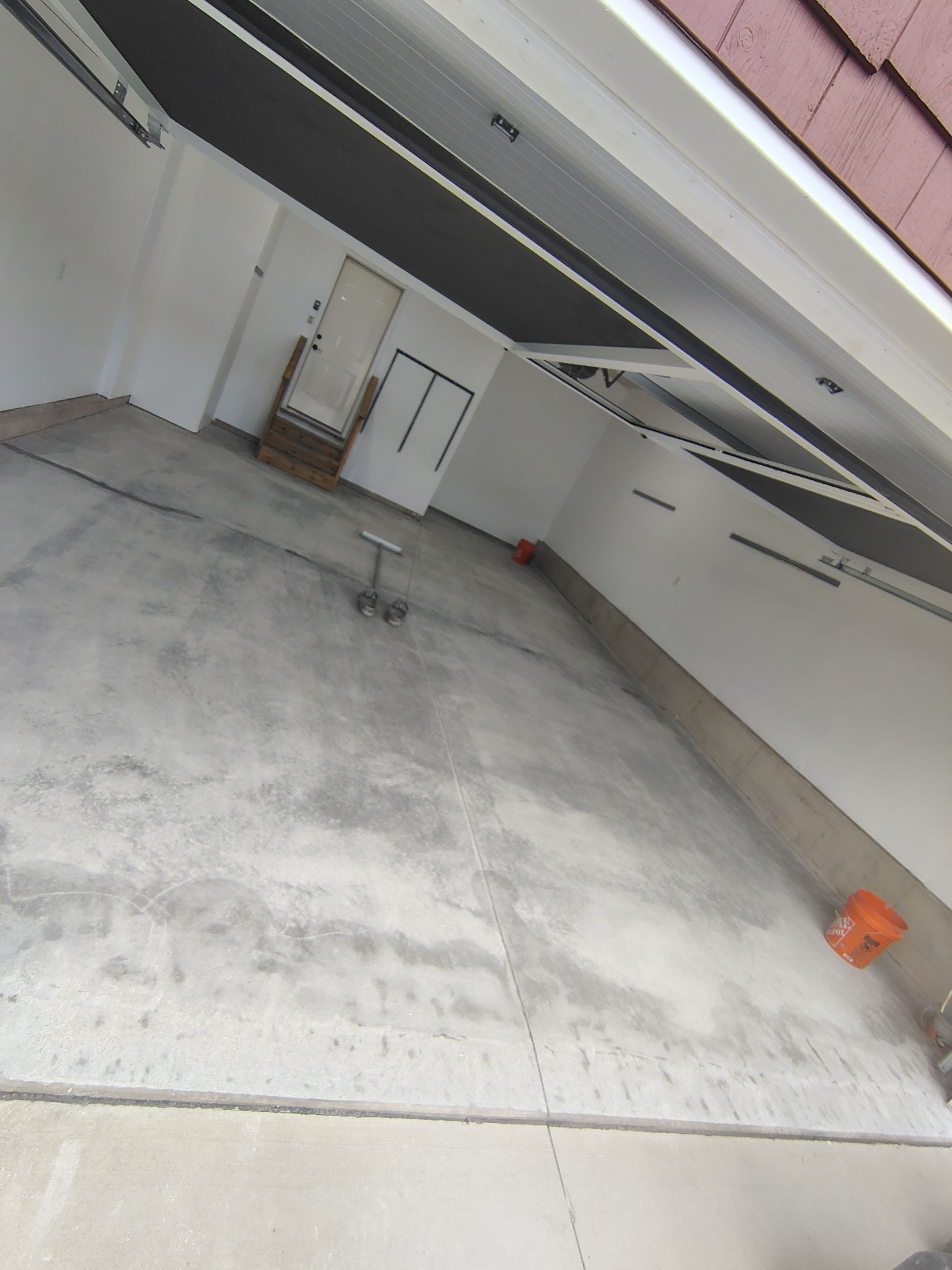 Sioux Falls Garage Floor Transformation With Gray Speckled Epoxy Coating by Select Painting, Coatings & Garage Cabinets