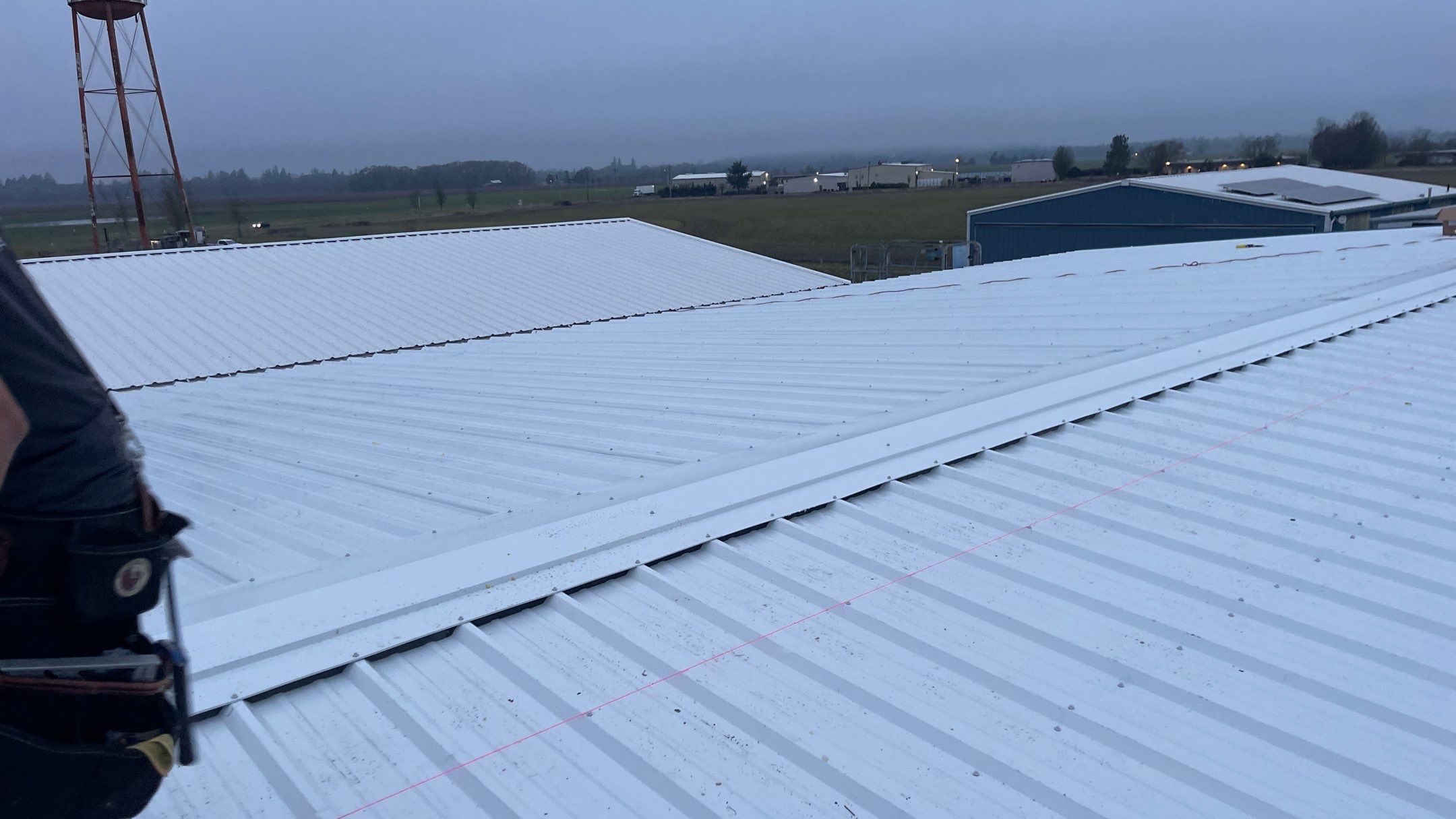 Airport Hanger Metal Roof Replacement and Insulation by Villegas Remodeling, LLC