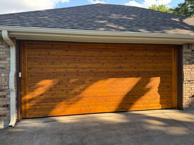 Custom Stained Cedar Garage Door Installation in Grapevine