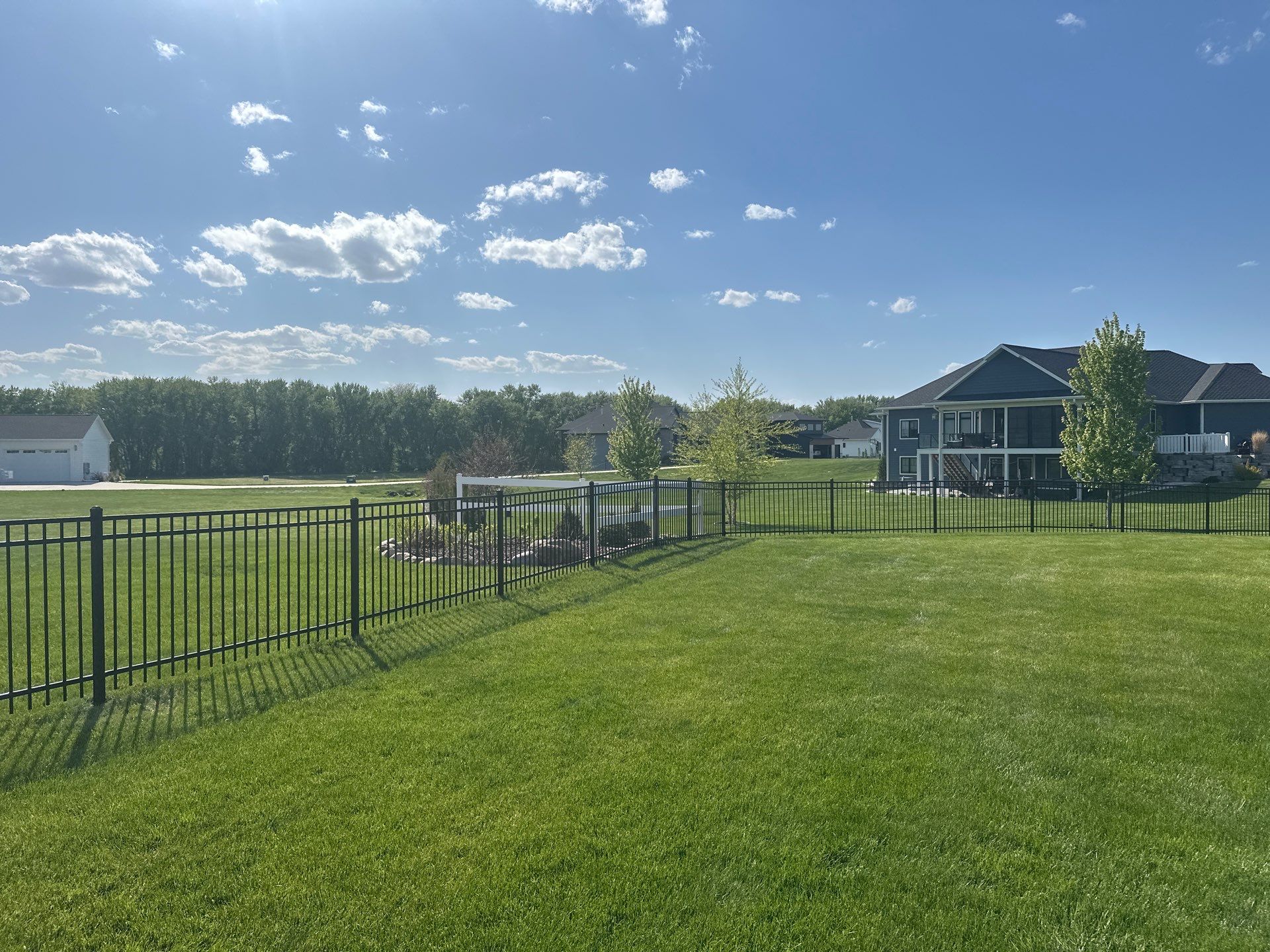 Black Ornamental Metal Picket Fence Installation in Waterloo by Perfect Picket Fence and Stain