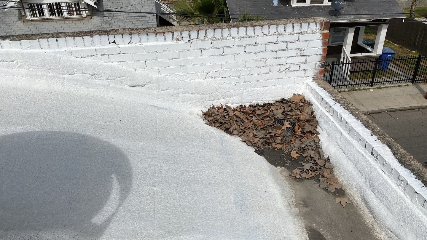 Polyurethane foam roof refurbish and recoating by Straight Edge Roofing Inc