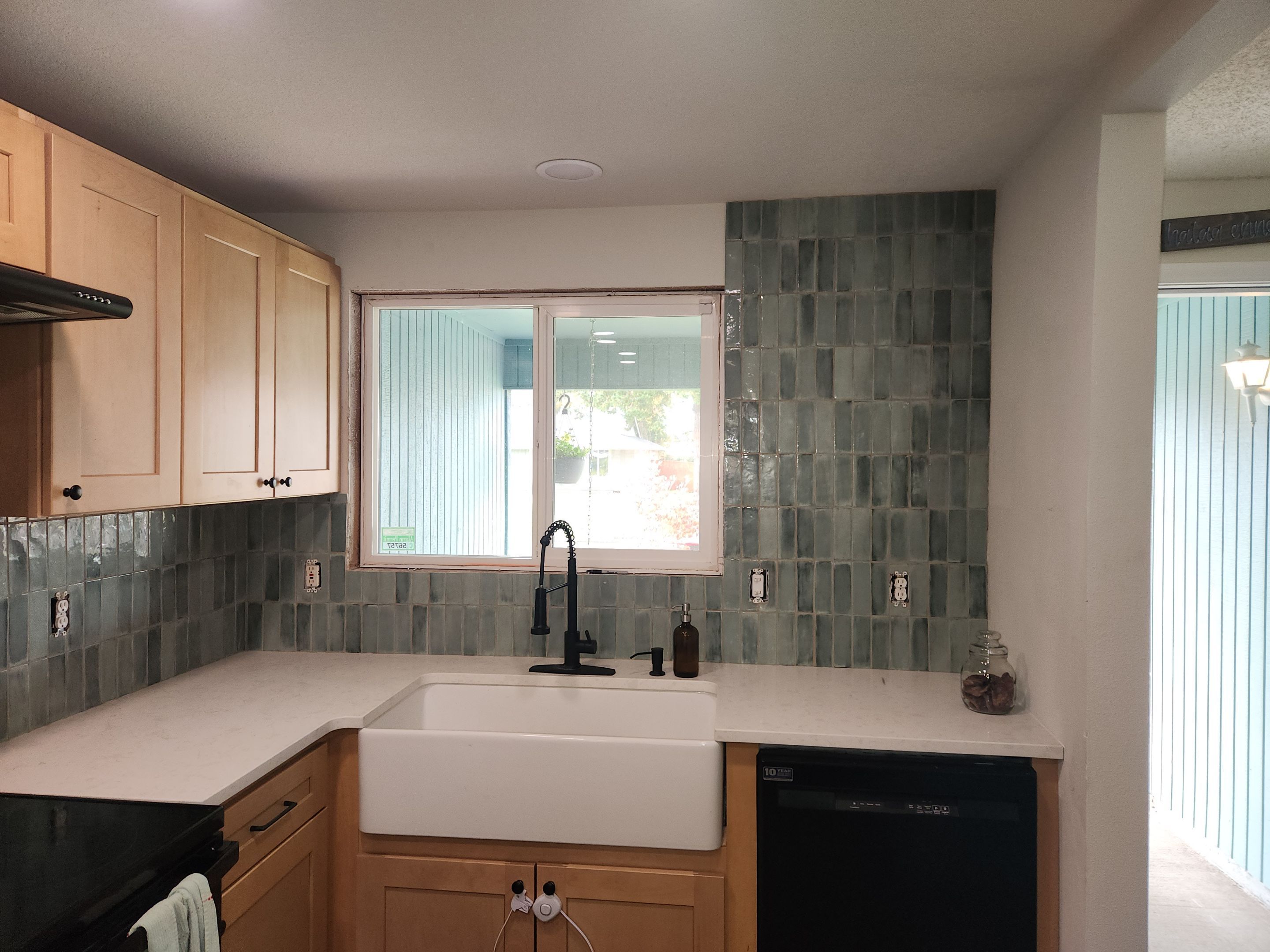 Vancouver Kitchen Renovation Featuring Tile Backsplash and Farmhouse Sink by American Made Construction 