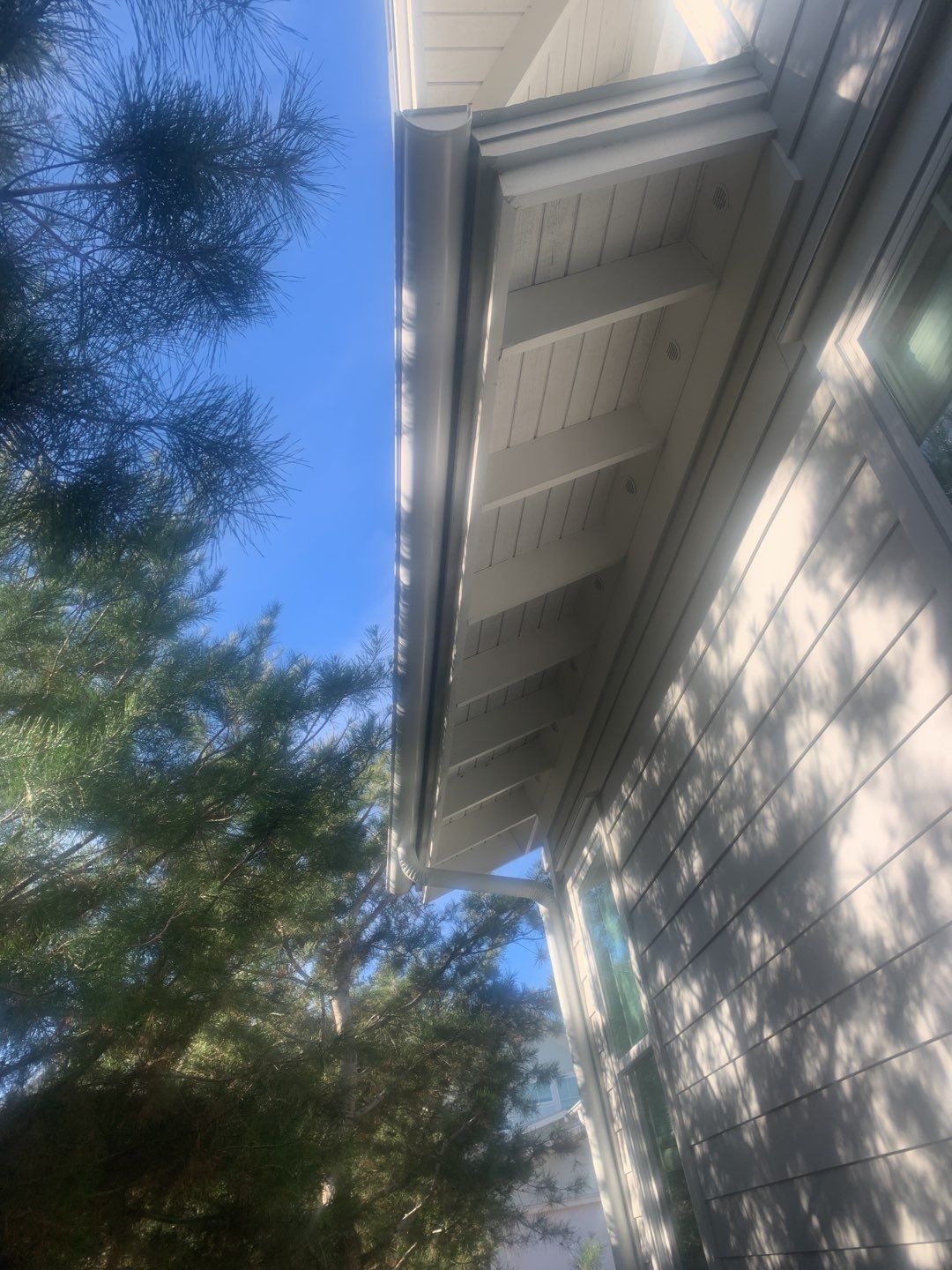 White Half-Round Gutters Installation in Rosemary Beach, FL by Gutter Professors