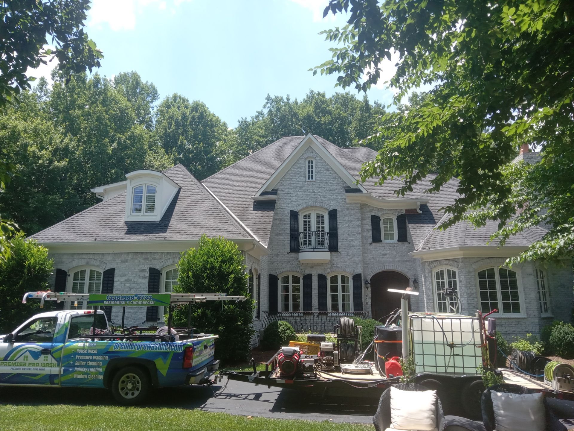 pressure washing exterior siding driveway walkways for a residential property with professional equipment