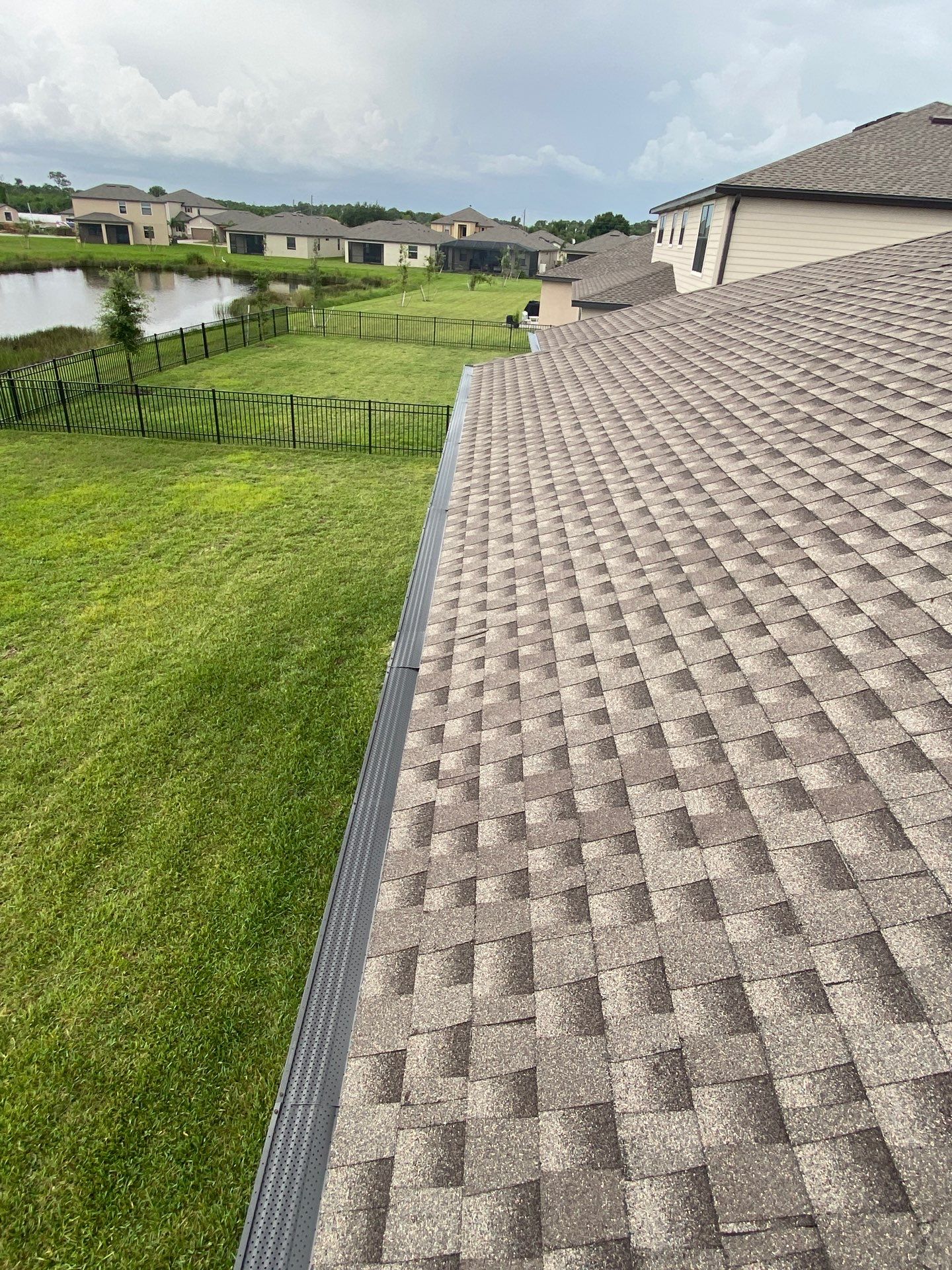 Brown Seamless Gutters for Homes in Fort Myers by Gutter Professors