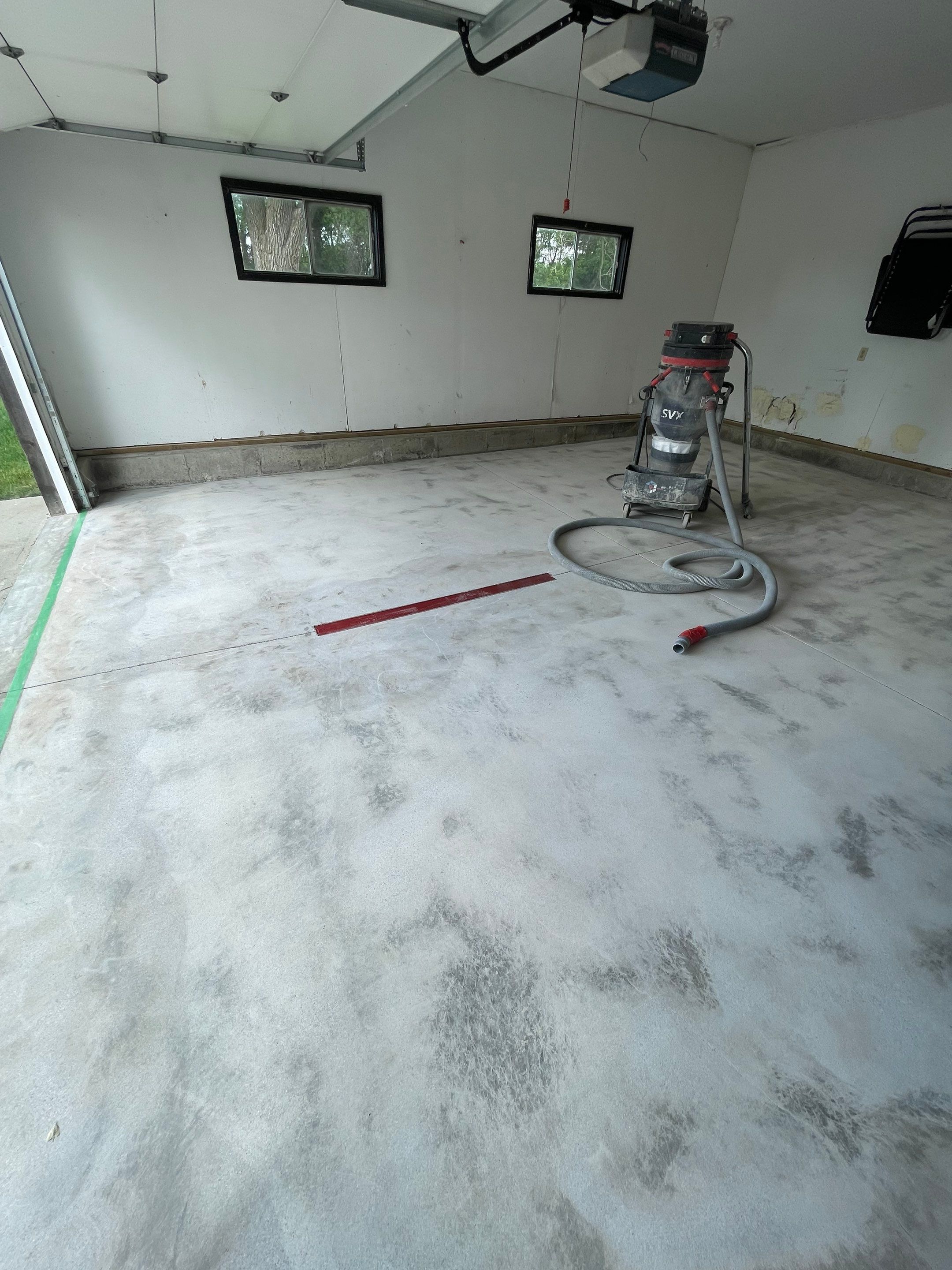 Hartford Residential Garage Floor Transformation With Decorative Chip Coating by Select Painting, Coatings & Garage Cabinets