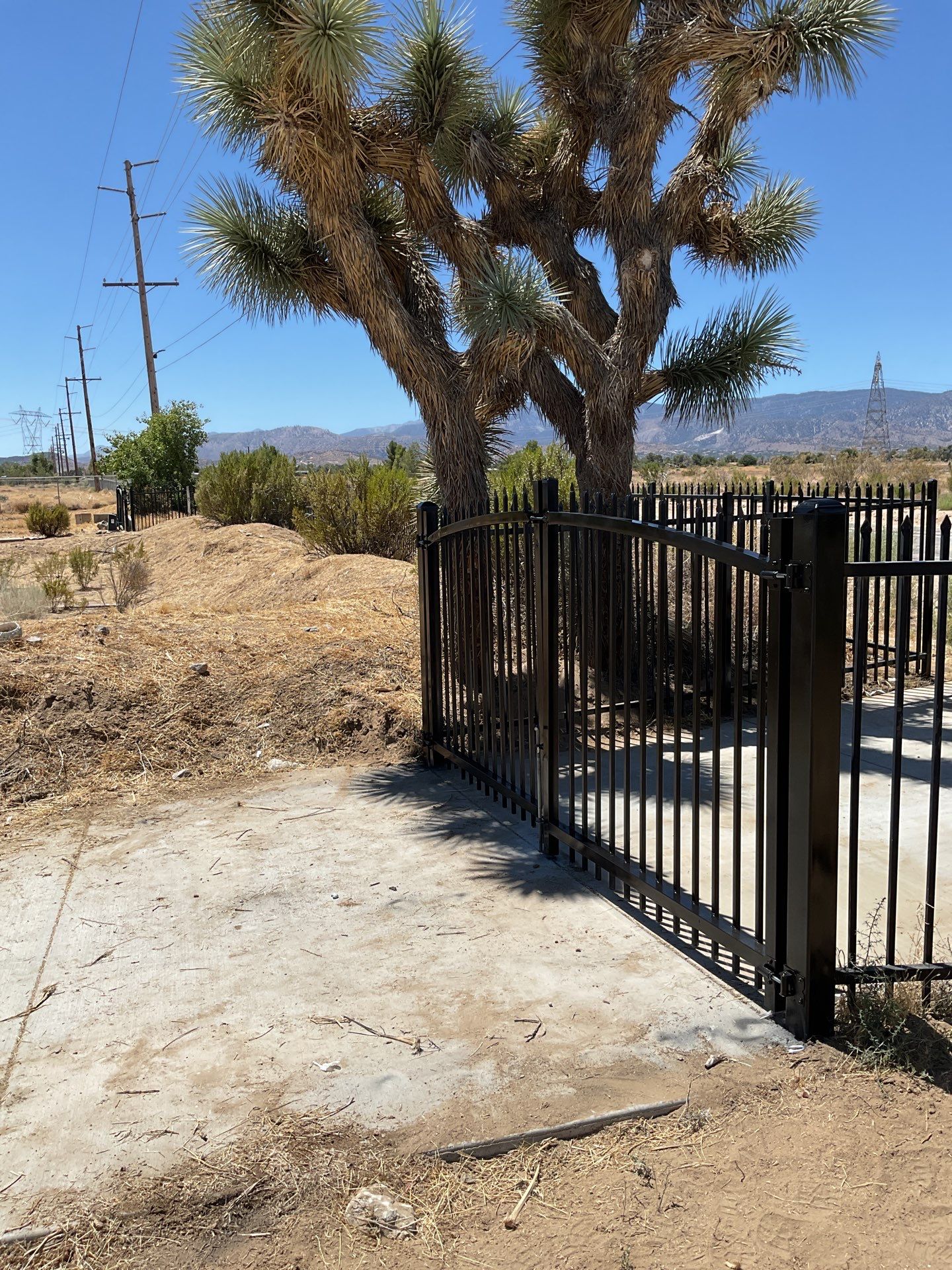 Gate installation using Wrought Iron by Fence Guys Inc. 