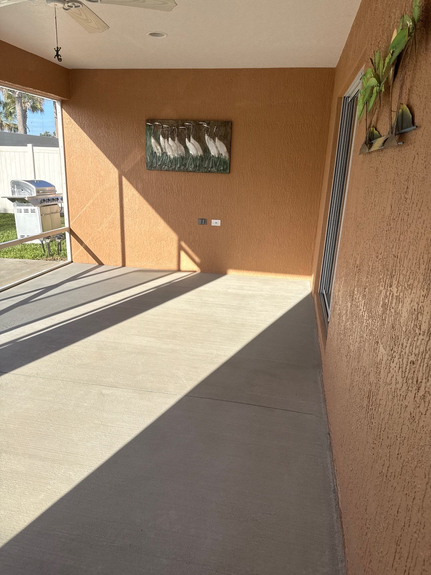 Garage and Lanai With Exterior Pad in Sandstone  by Innovative Concrete Coatings 