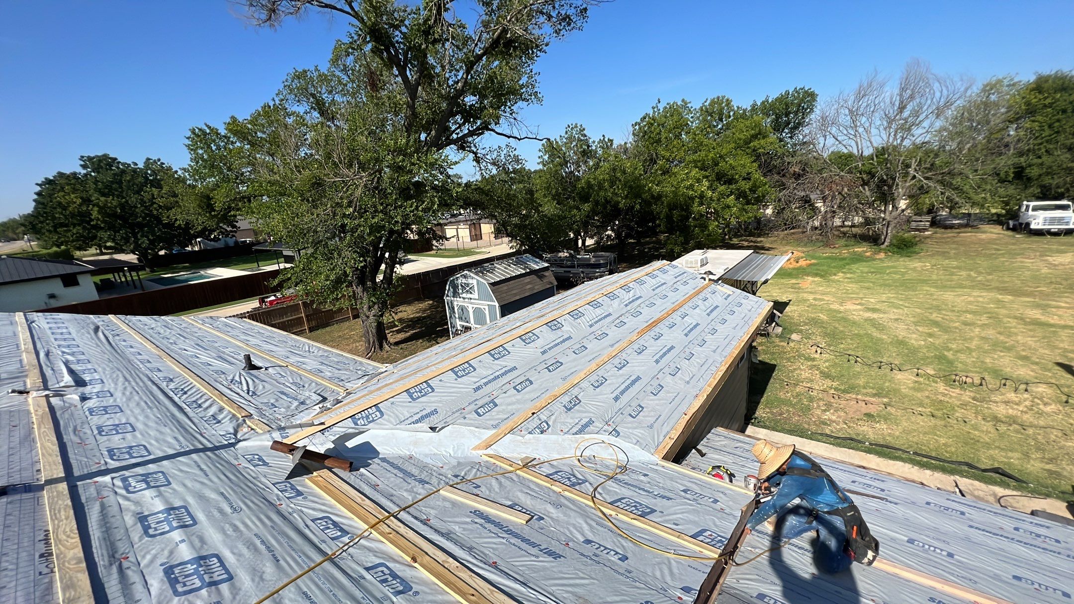 Residential Roofing Installation using PBR Metal Roof by Harvey Roofing & Construction