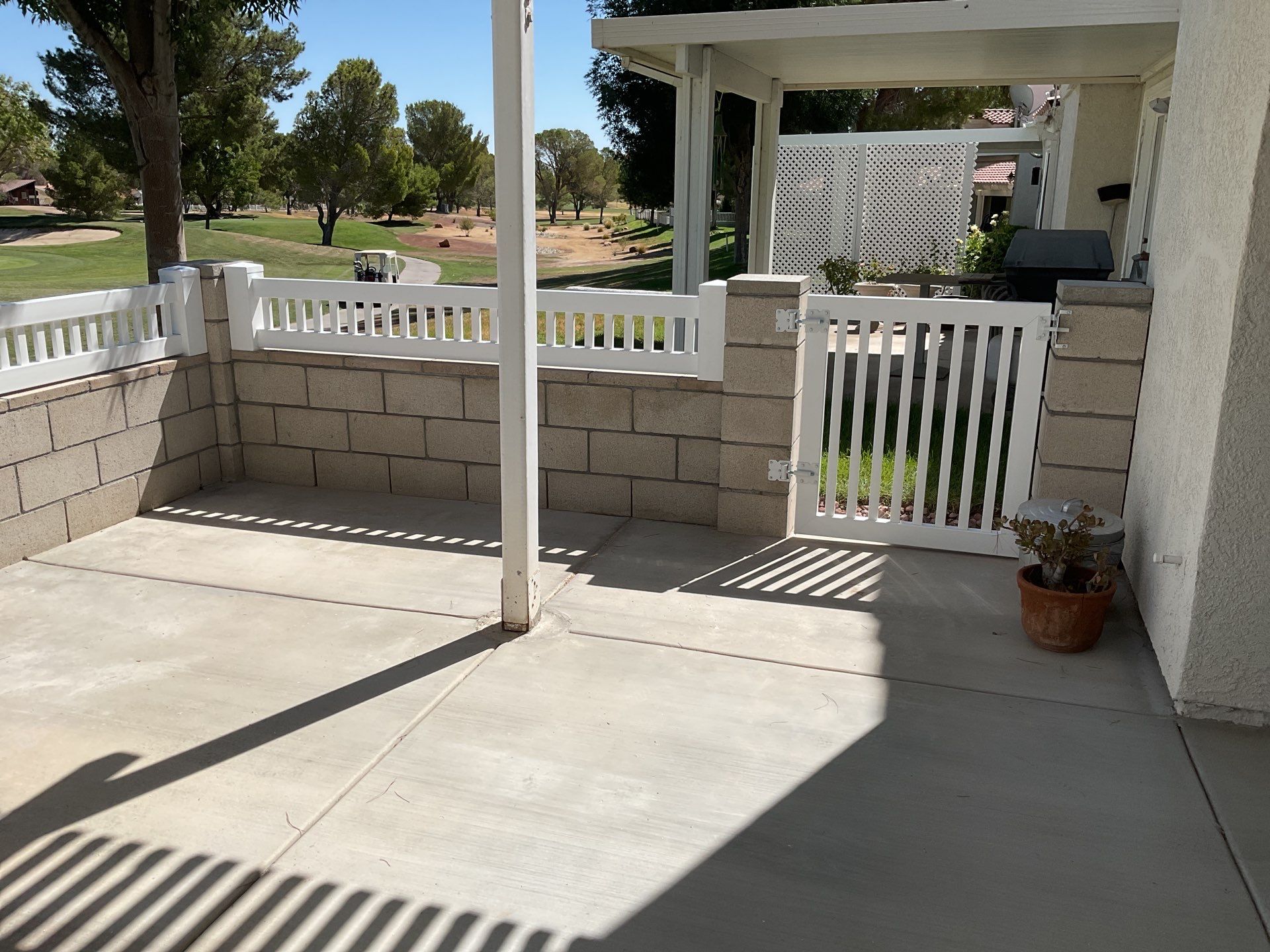 White Box Picket Fence on top of block wall  by Fence Guys Inc. 