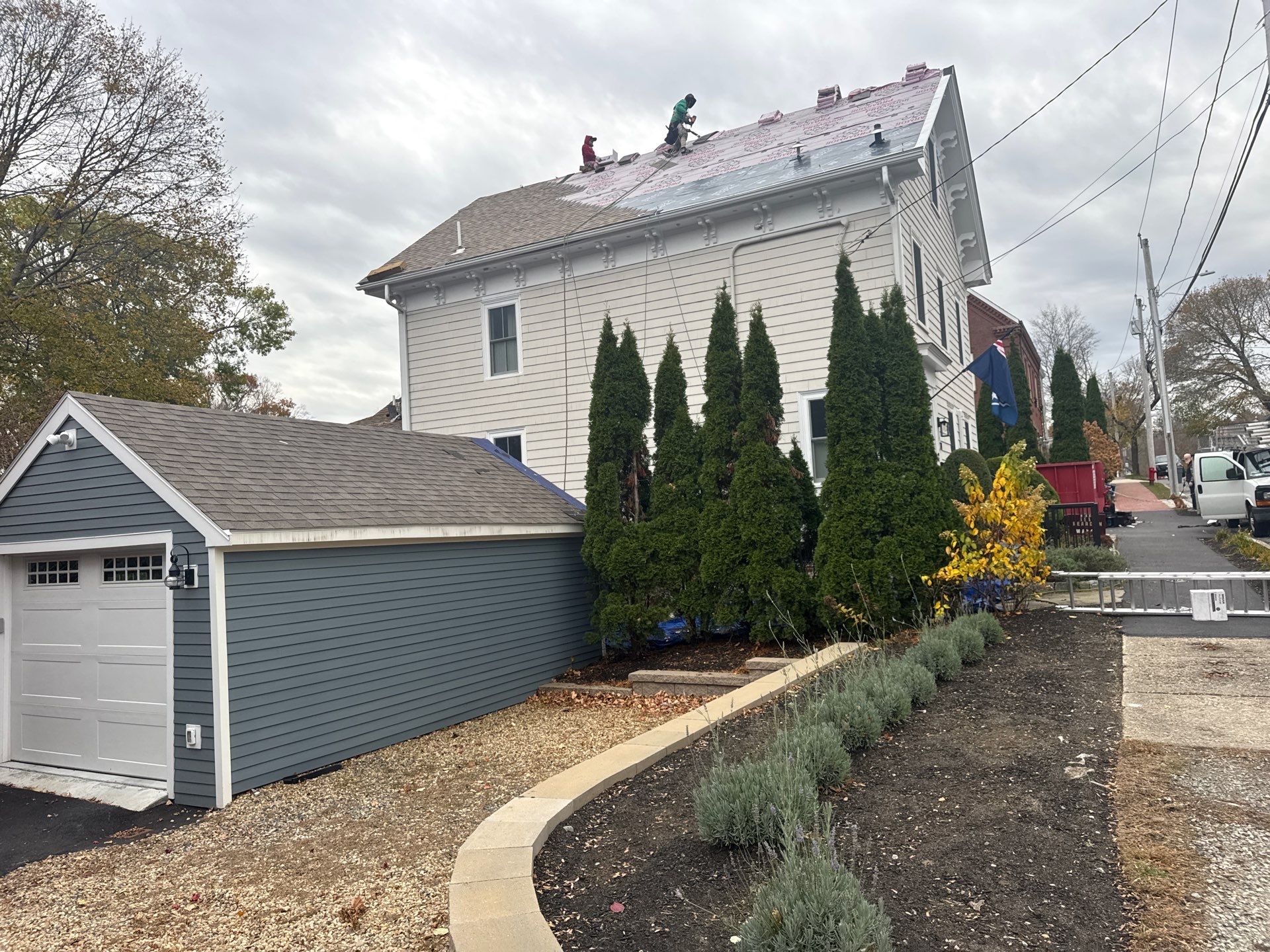Newburyport Complete Roof Replacement with Solar Venting Skylight by Mighty Dog Roofing of Greater Middlesex County