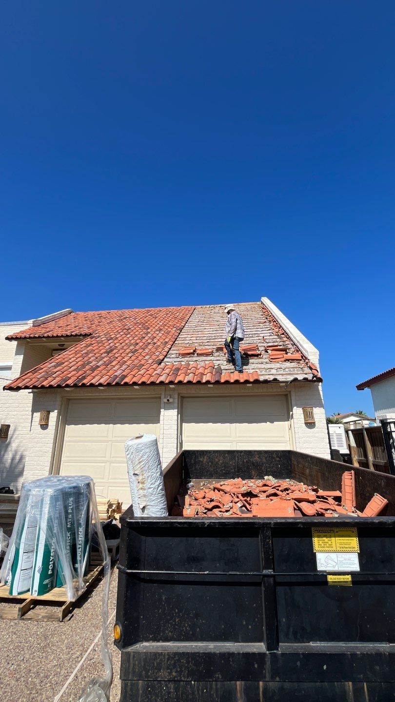 Off with the Tile and on with the TILCOR stone coated metal.  by Bayfront Roofing and Construction