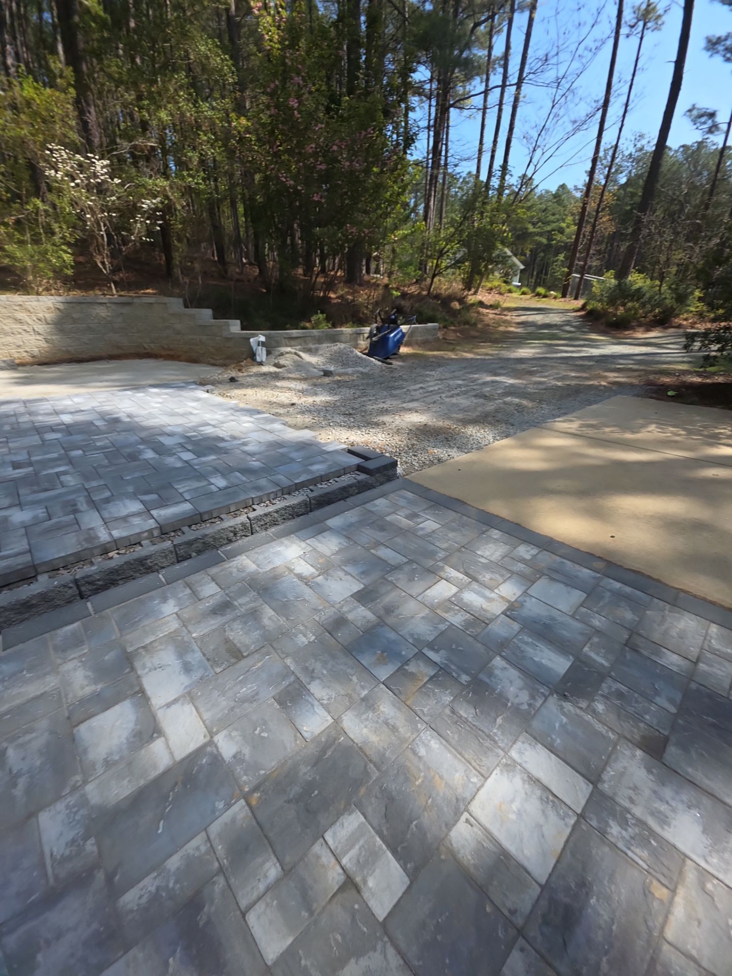 Pittsboro Outdoor Living Transformation – Retaining Wall, Paver Patio & Elevated Deck by Elite Remodeling and Design LLC