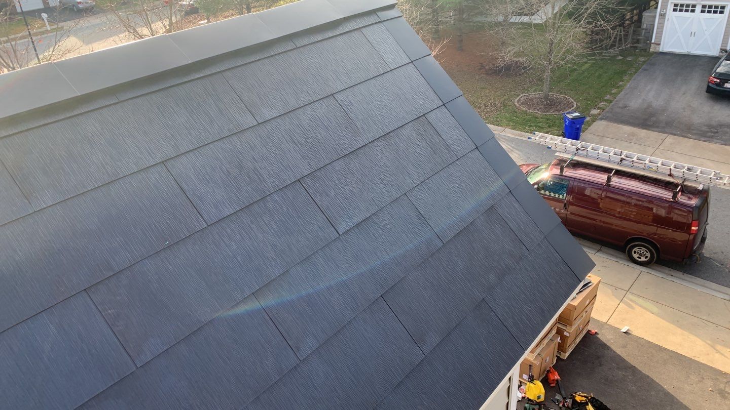 Tesla Solar Roof and Gutter Installation by American Home Contractors