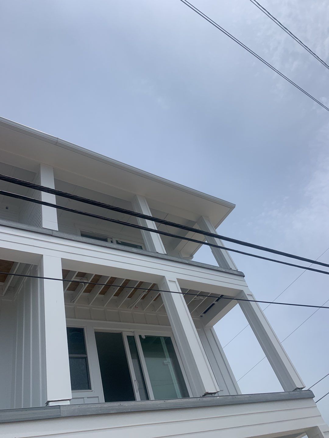 Downspout Installation for Multi-Story Building in Panama City FL by Gutter Professors