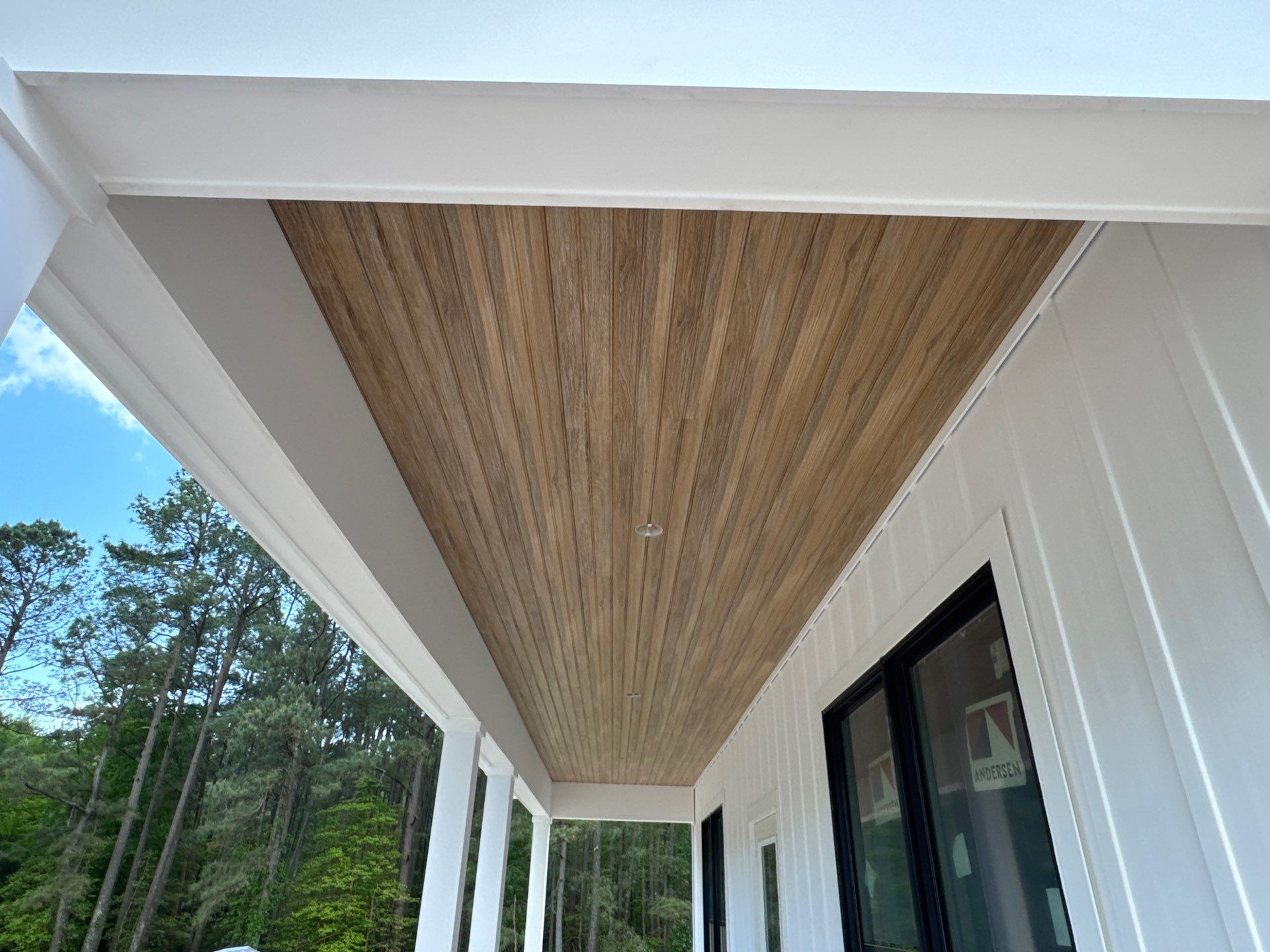 Two-Story Custom Home With Board and Batten Siding by Cade Construction