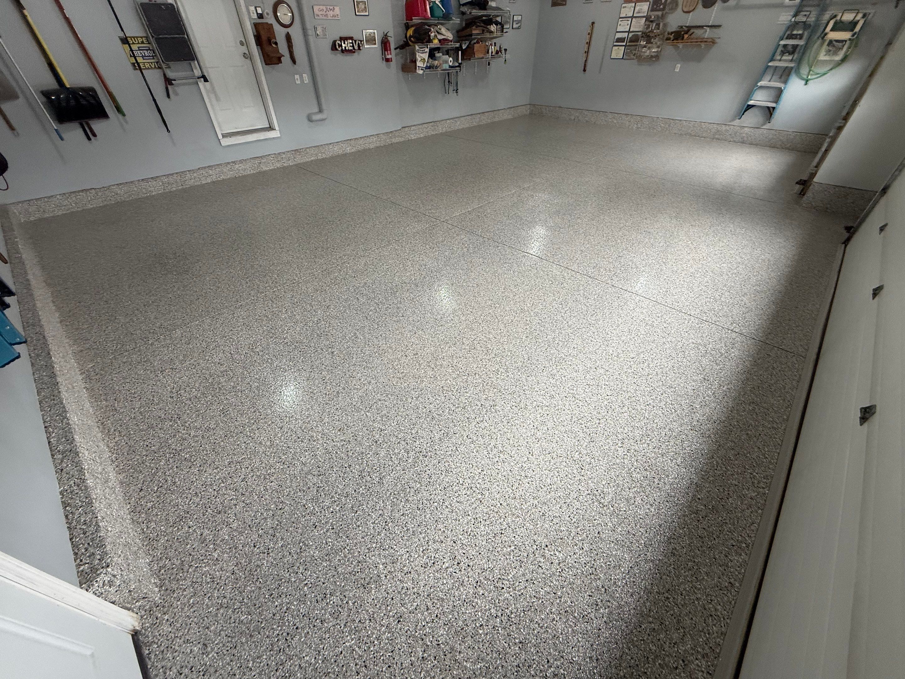 High-Gloss Epoxy Garage Floor Coating in Sioux Falls by Select Painting, Coatings & Garage Cabinets