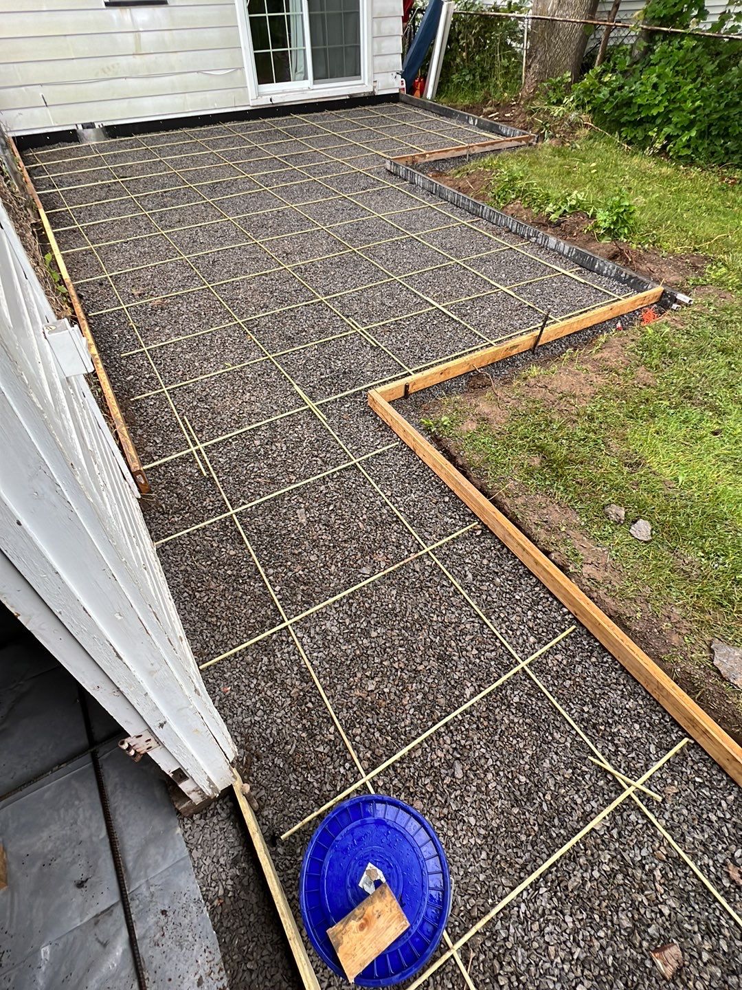 Broom finished patio and garage floor replacement  by NG Masonry & Construction LLC