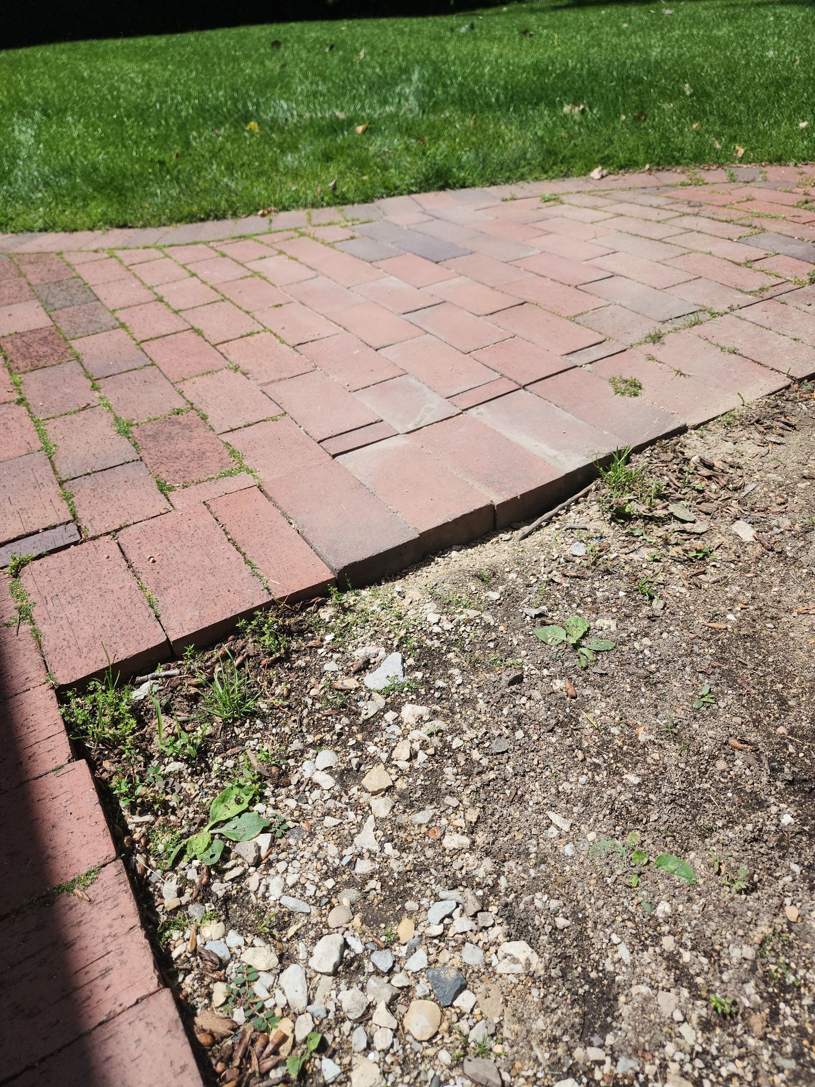 Brick paver repair, cleaning and sealing by Northern Power Washing LLC.