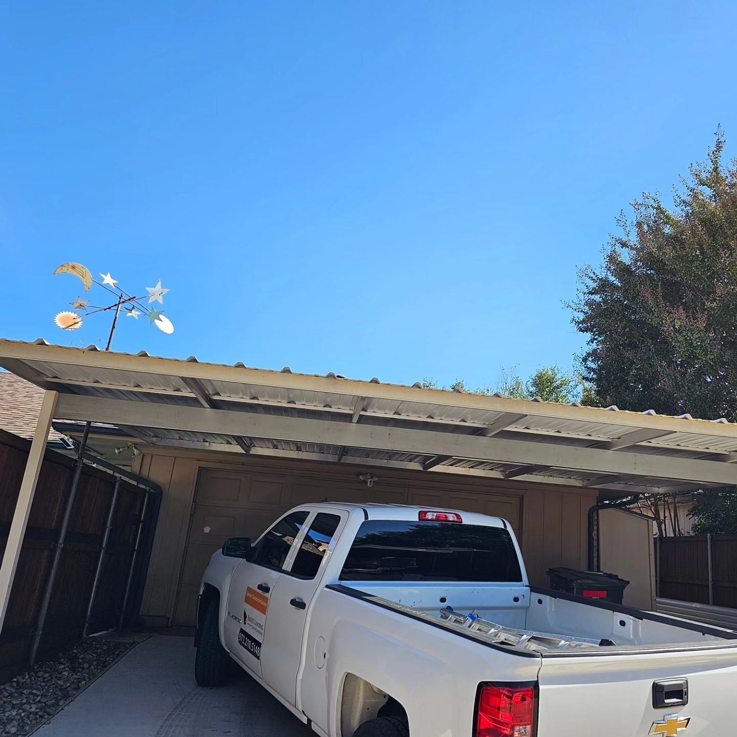 Carport & fence stain by EL-GC LLC 