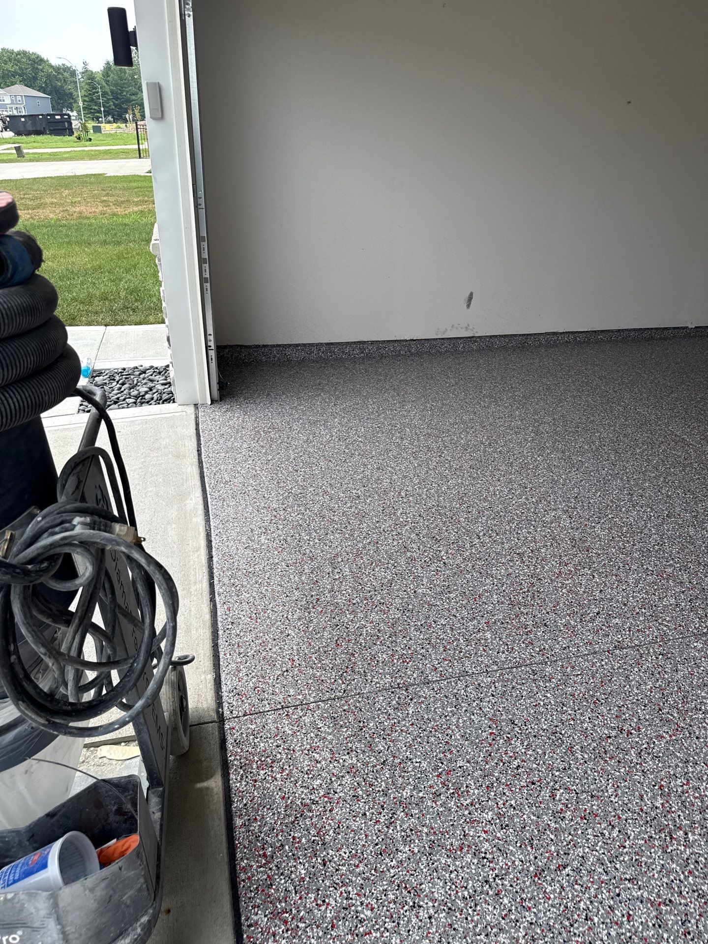 Custom Flake Garage Floor Coating Installation in Altoona by Revival Concrete Coatings