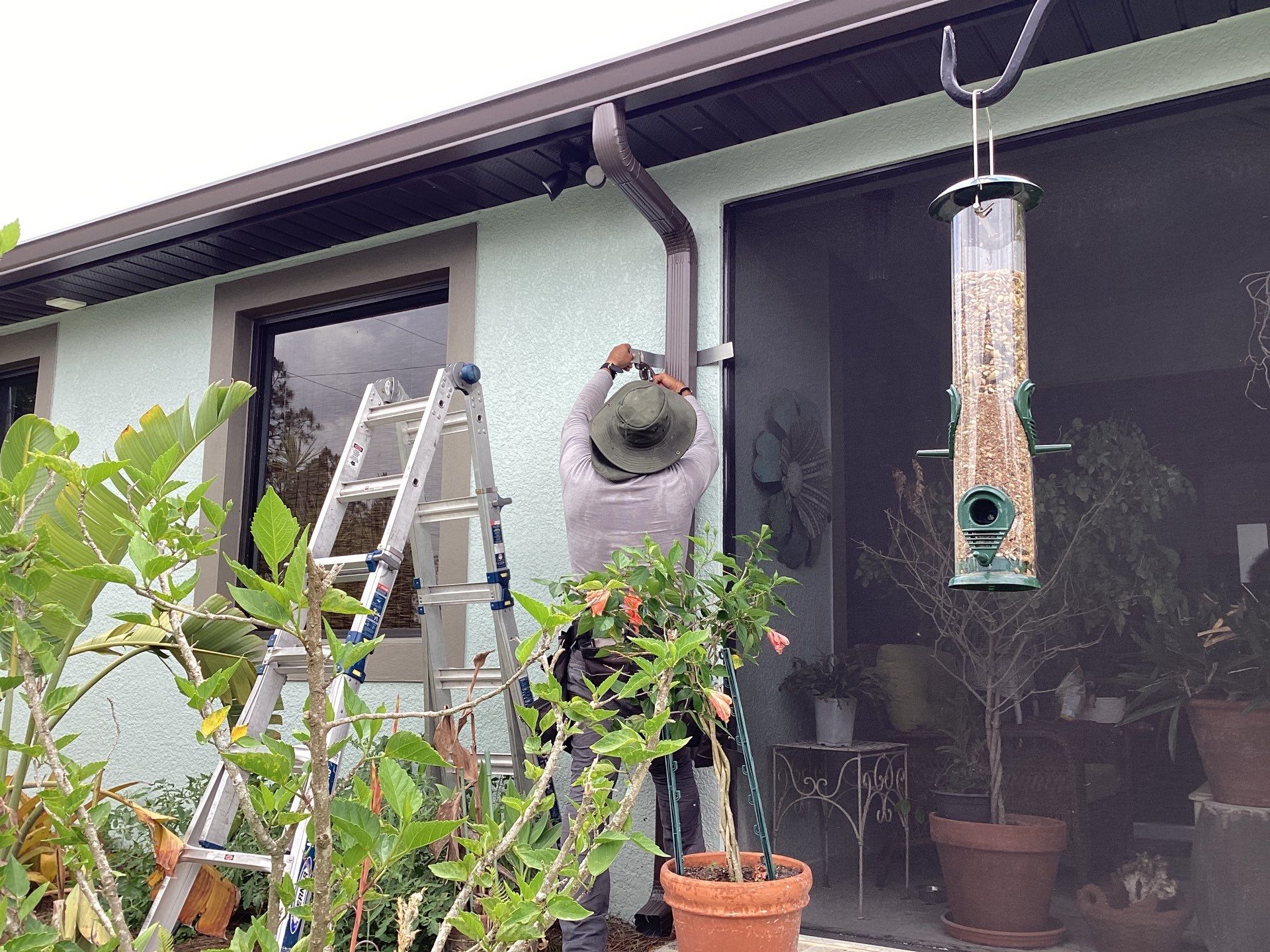 Musket Brown and New Downspouts in Lehigh Acres, FL  by Gutter Professors