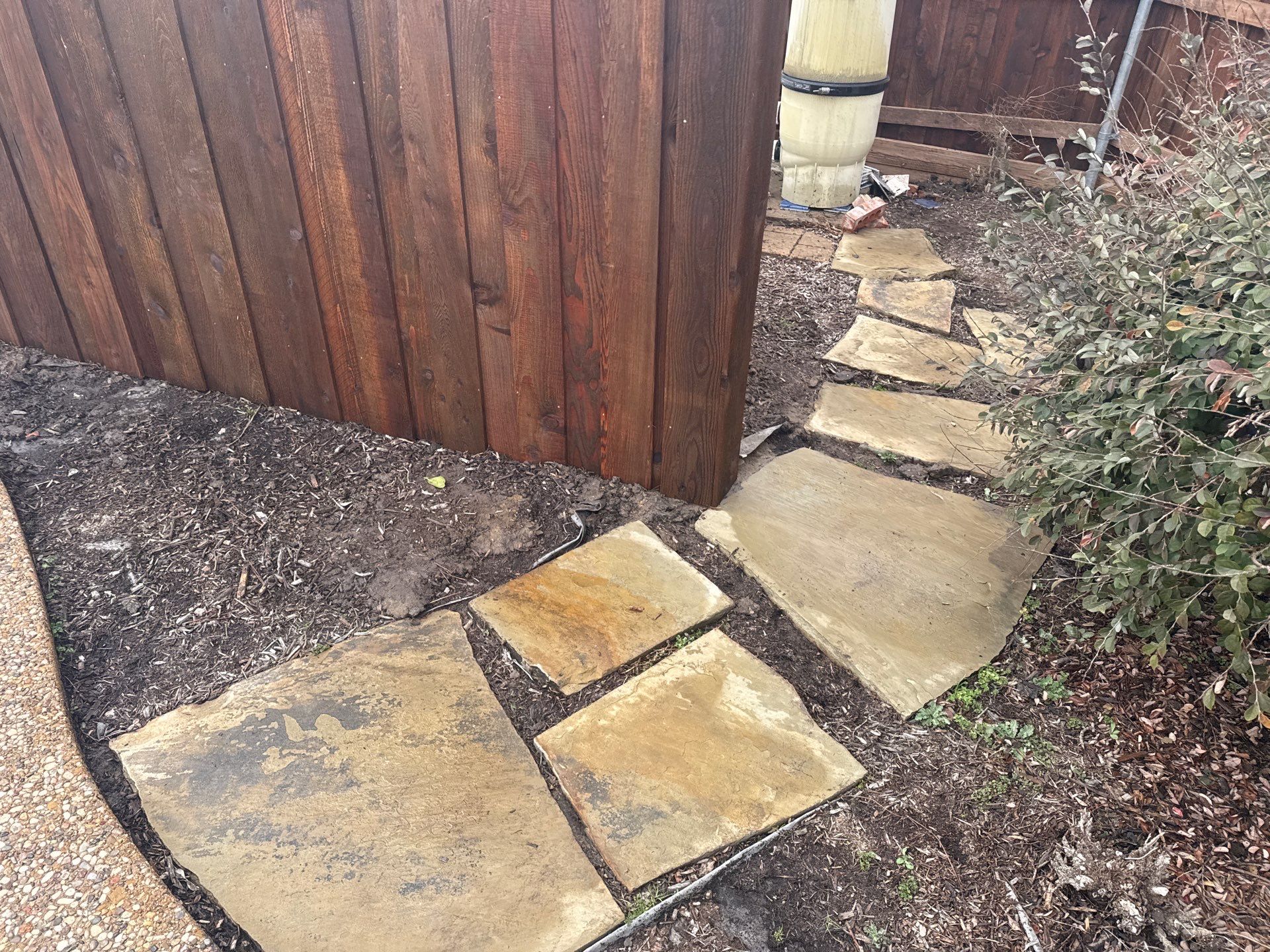 Pre-Stained board on board w/ trim and kickboard using 1x4 cedar trim by Grizzly Fence And Patio