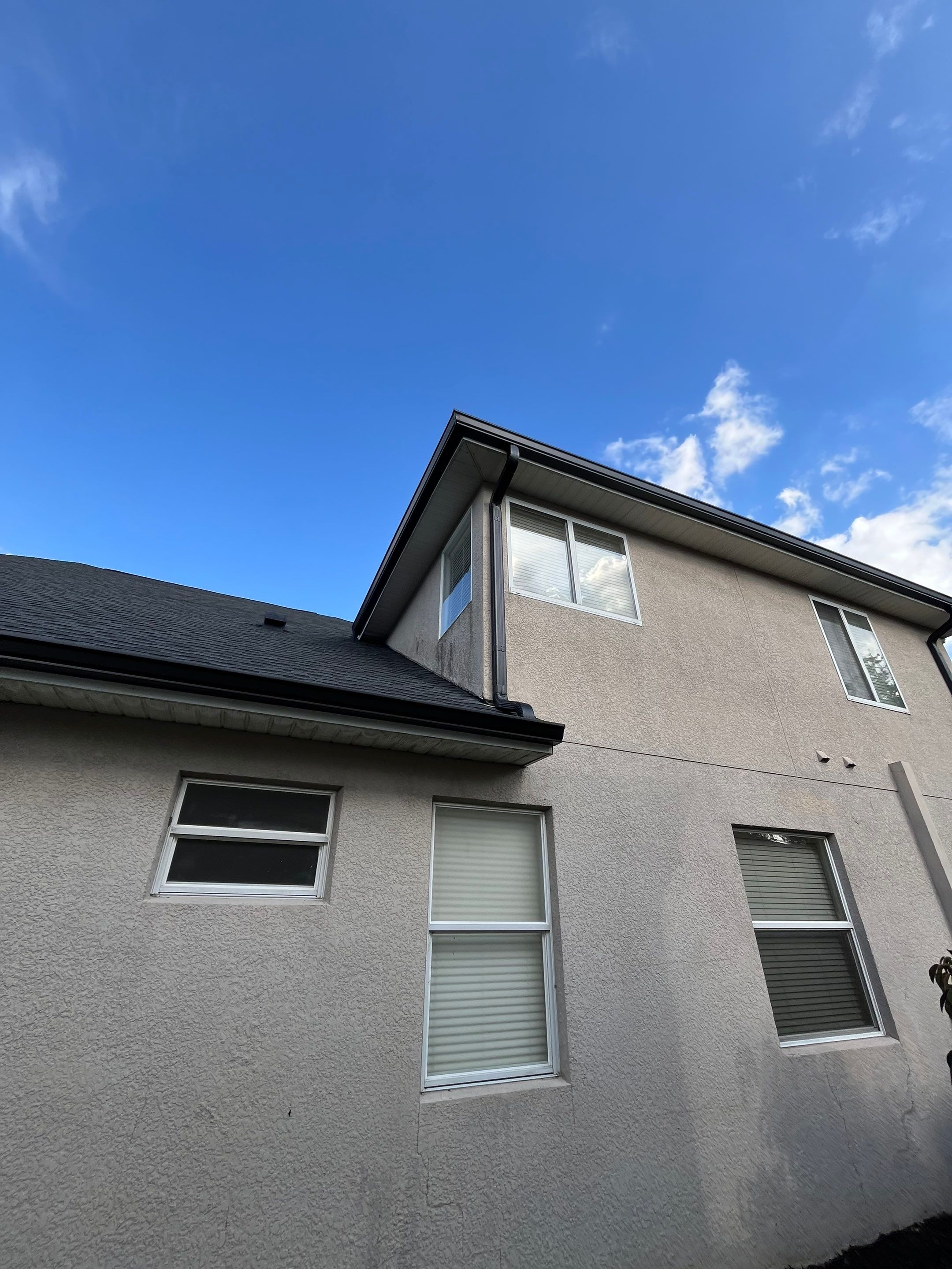 Black 6-inch Seamless Gutters for Modern Ellenton Homes FL by Gutter Professors