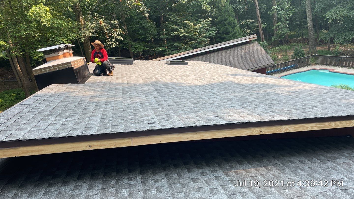 Deckhouse Roof Replacement by American Home Contractors