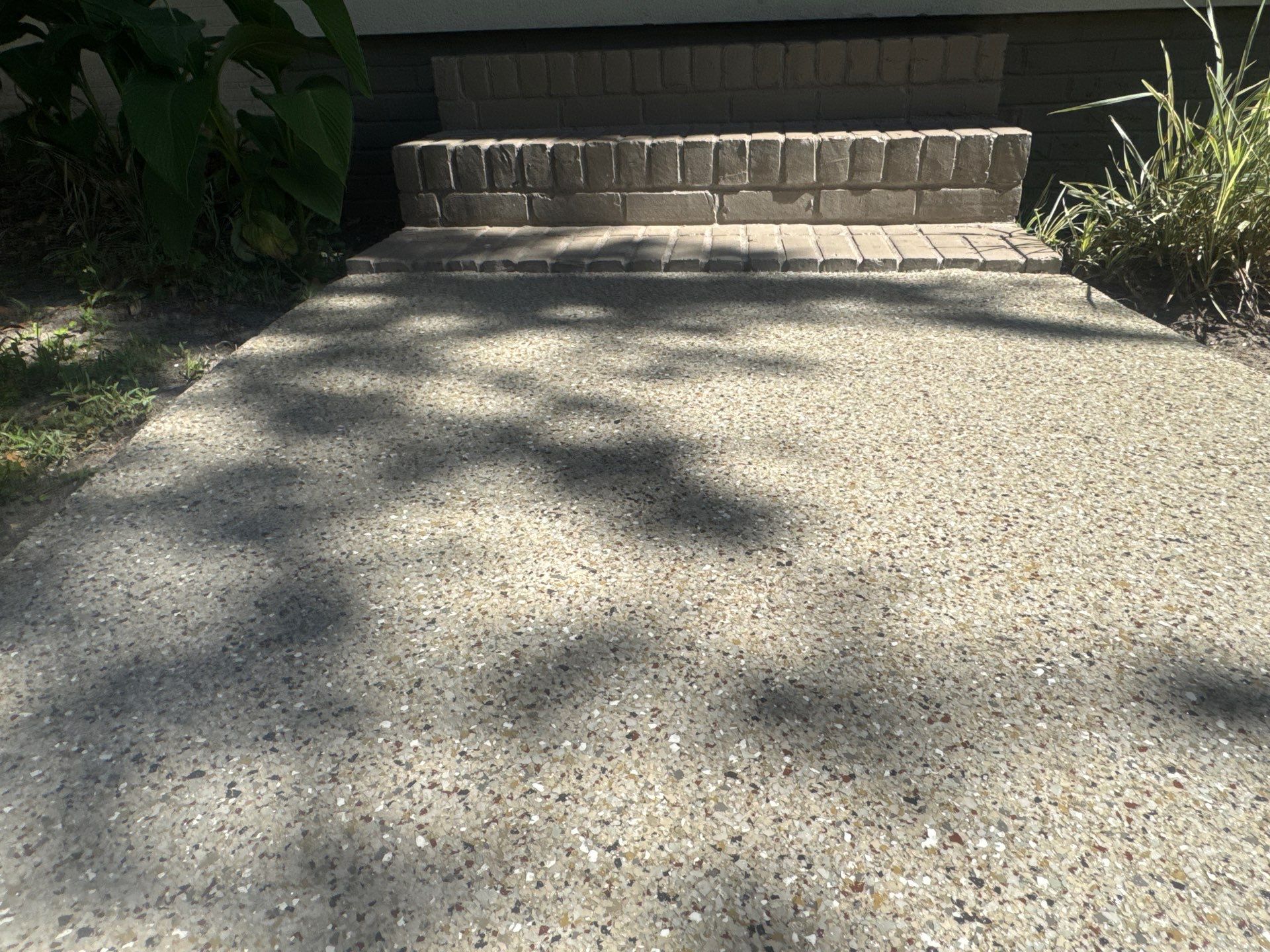 Garage and Sidewalk Project in Keystone Heights, FL in Pebble Beach by Cross Creek Concrete Coatings