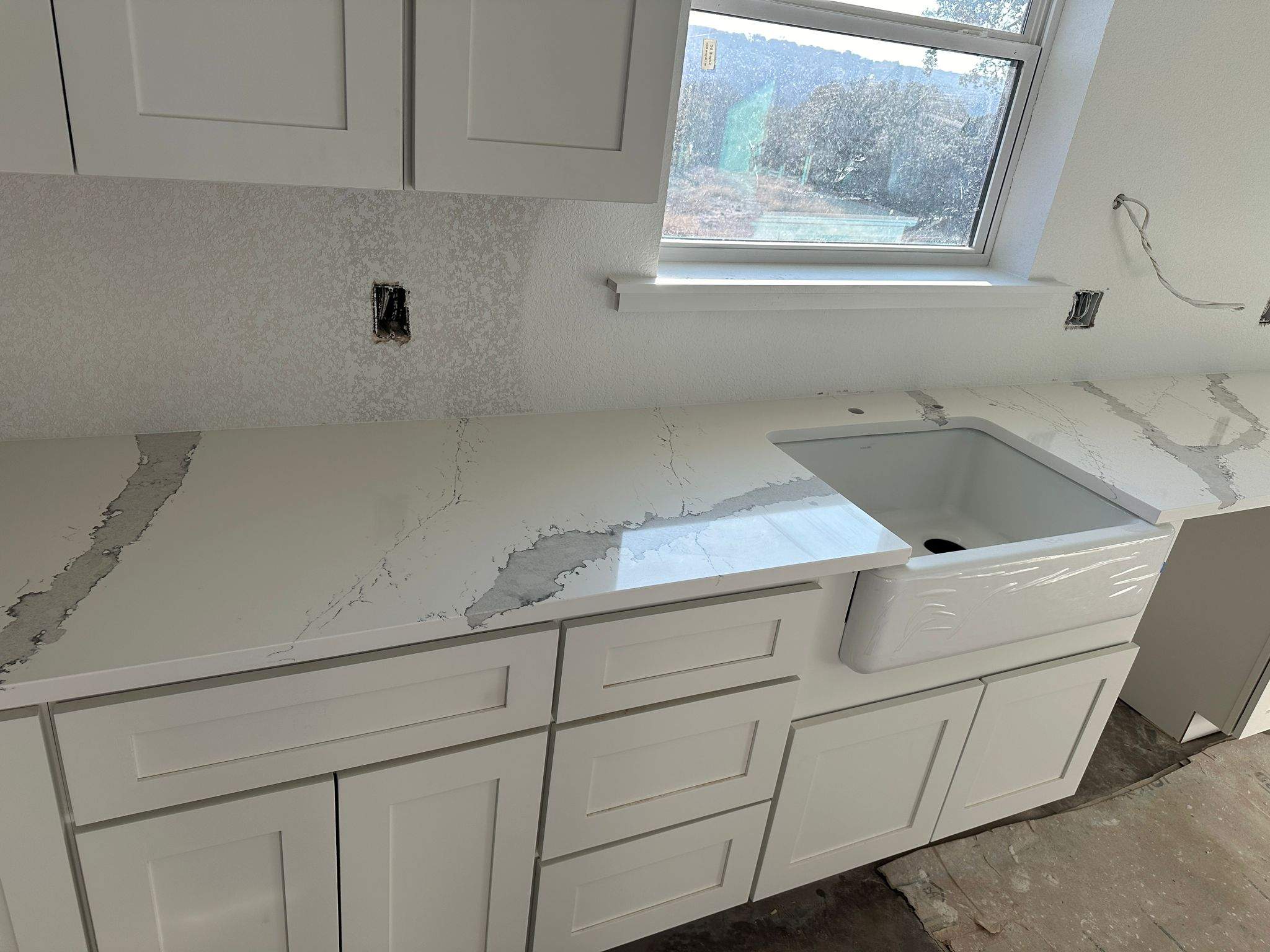 Kitchen and Bathroom Countertop Upgrades Featuring Gray Veined Quartz by Mena stone surfaces