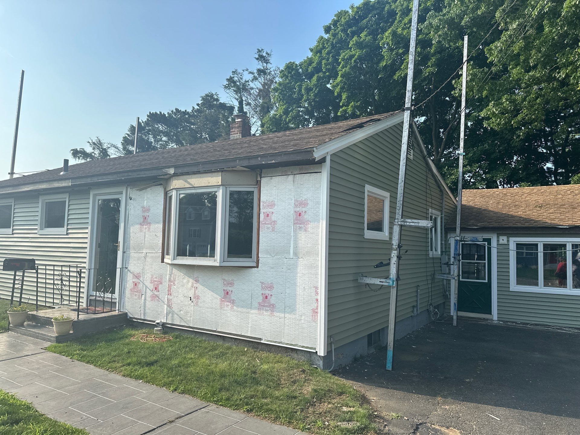 Siding Installation using Clapboard Monogram D4 Cypress by A Plus Exterior