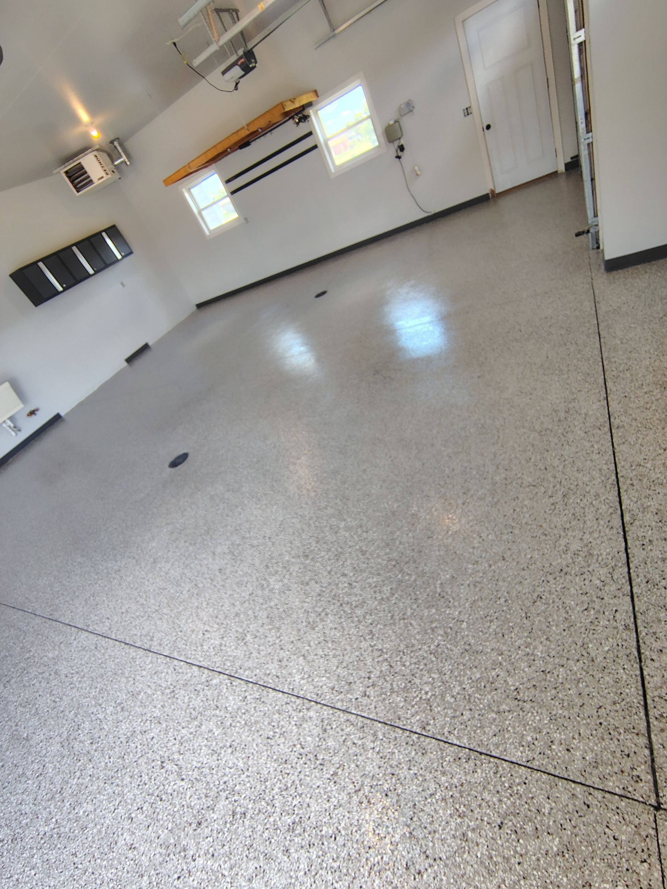 Multi-Car Garage Concrete Coating and Crack Repair in Dell Rapids by Select Painting, Coatings & Garage Cabinets
