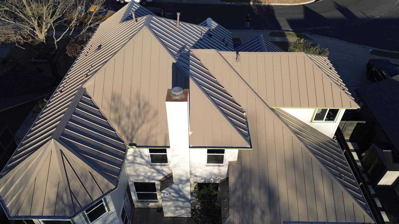 Three Tab Shingles To Metal Standing Seam by DeZign Roofing & Exteriors