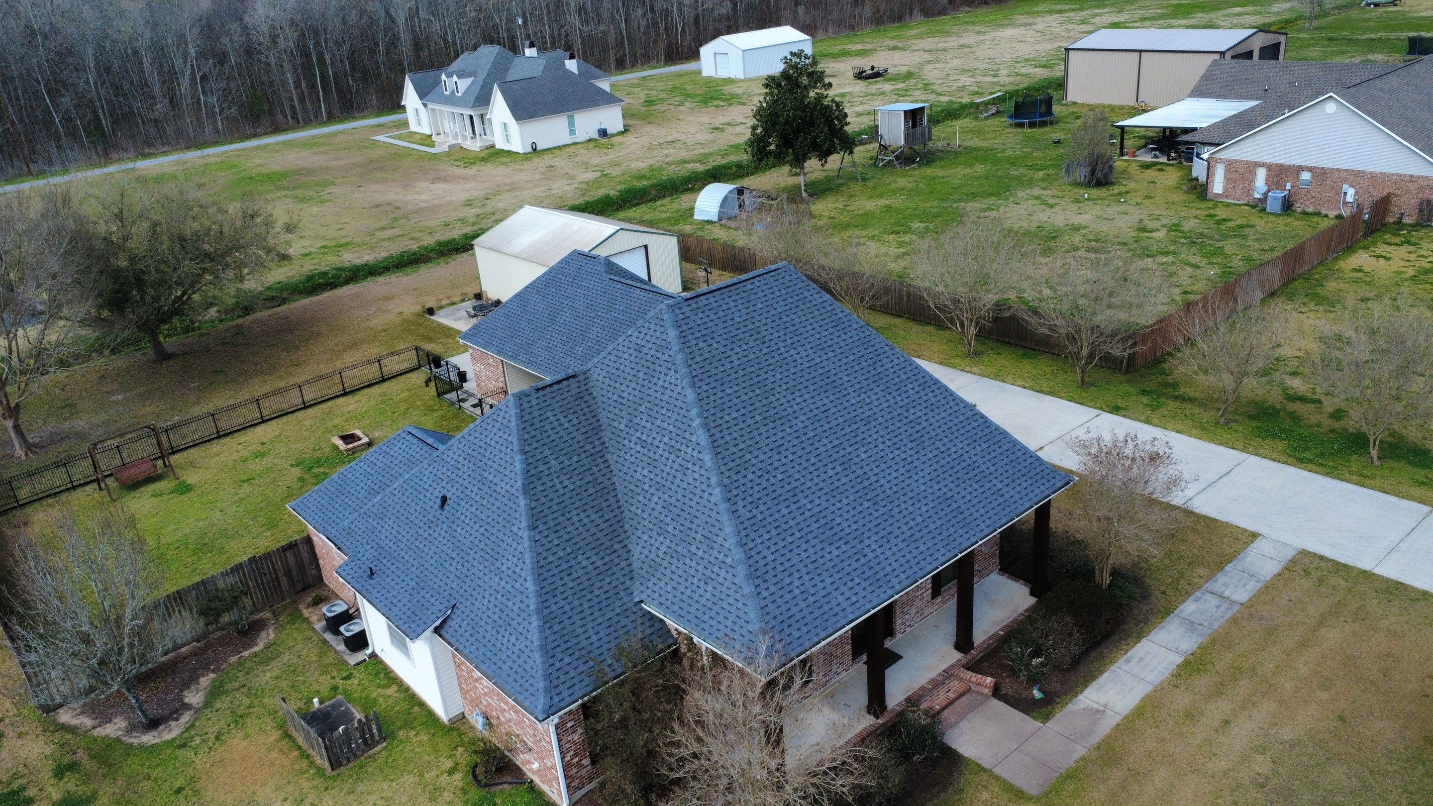 Residential roof installation in Plaquemine, LA using Atlas Pinnacle Pristine Pewter shingles  by Top Team Roofing & Construction