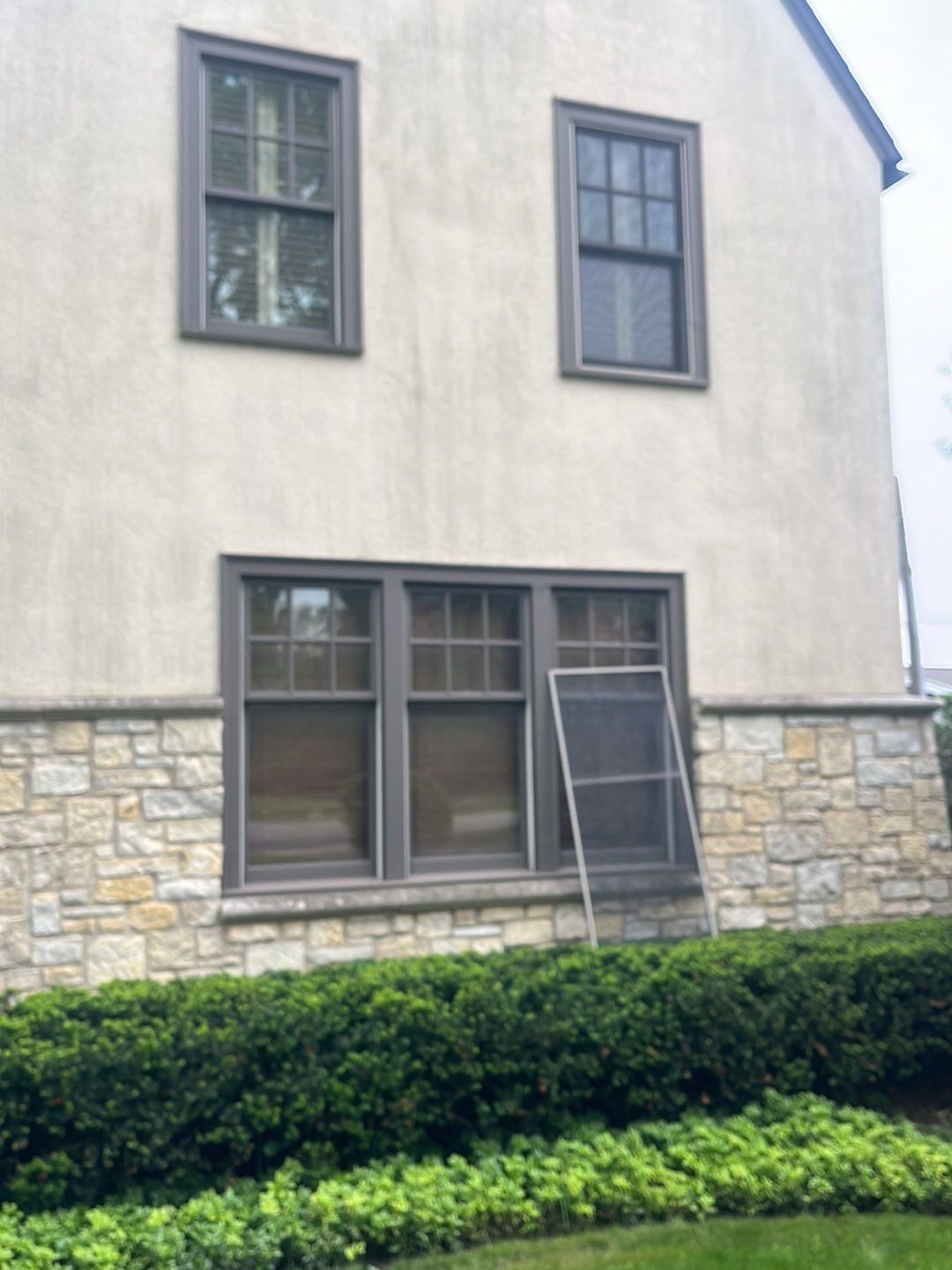 Northbrook, IL stucco home soft wash and stone cleaning by Northern Power Washing LLC.