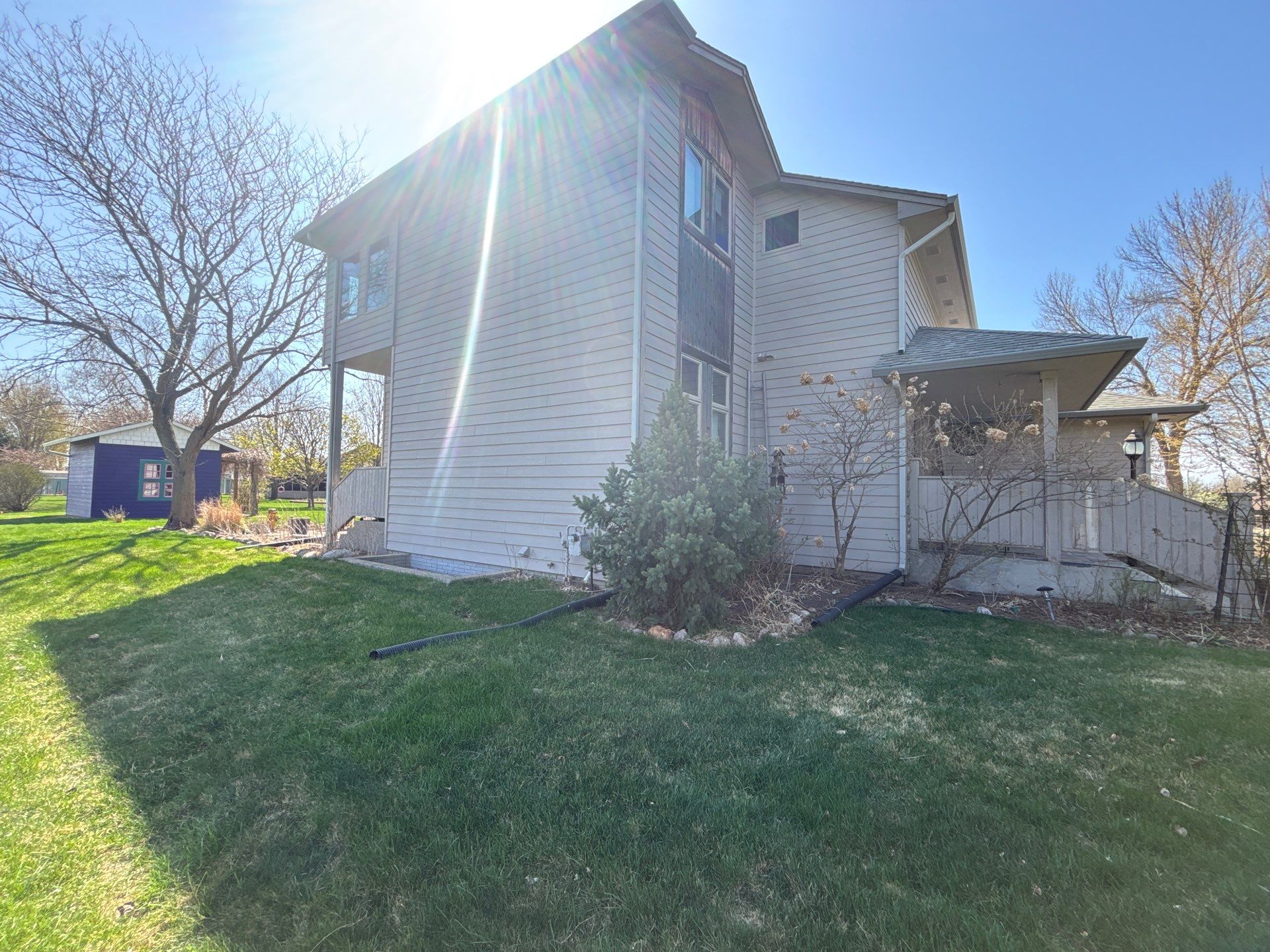 Exterior Siding and Trim Painting for Sioux Falls Residence by Select Painting, Coatings & Garage Cabinets