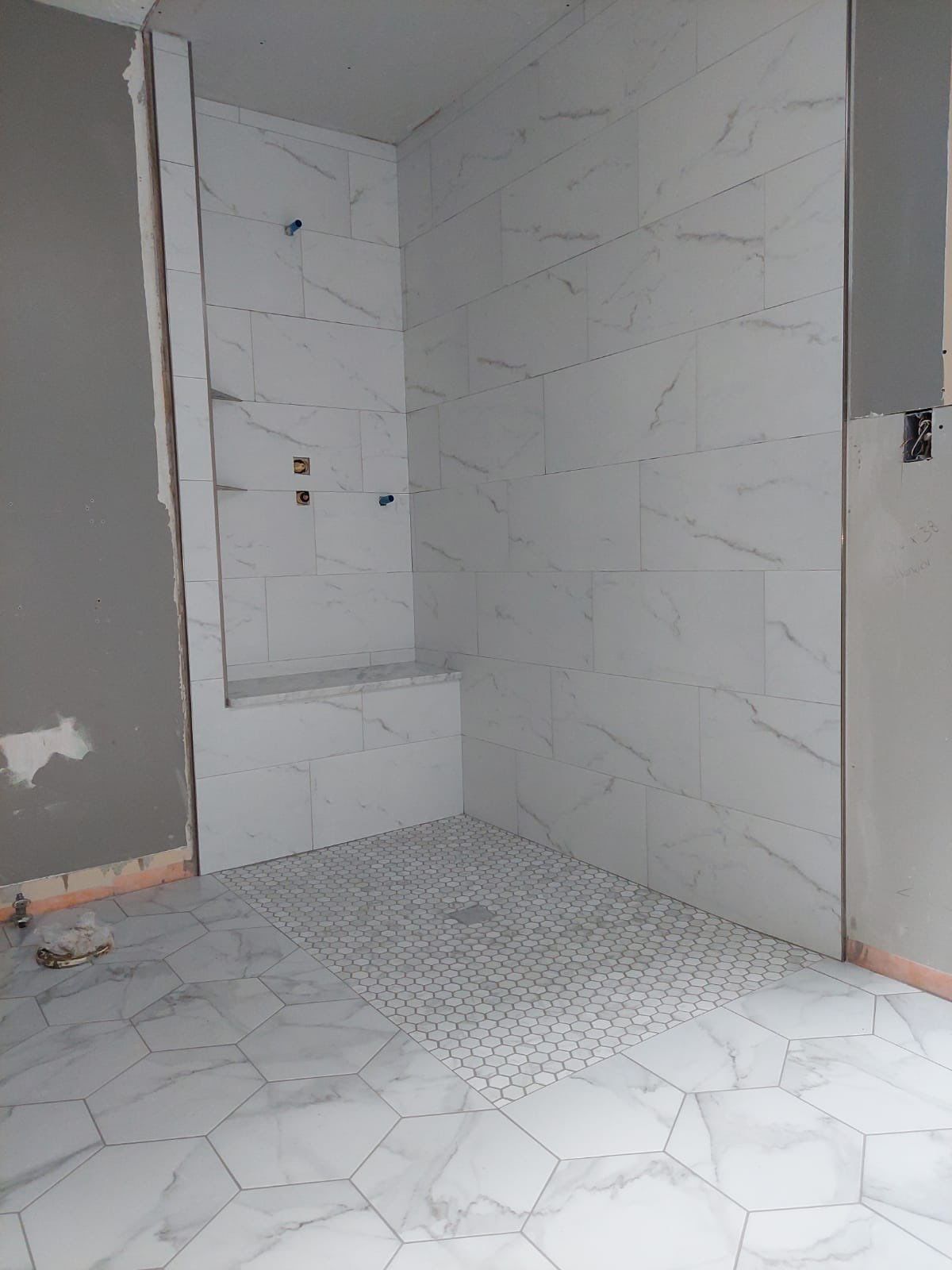Luxury Bathroom Remodel with Marble Tiles in Kennesaw by Swift Home Renovations 